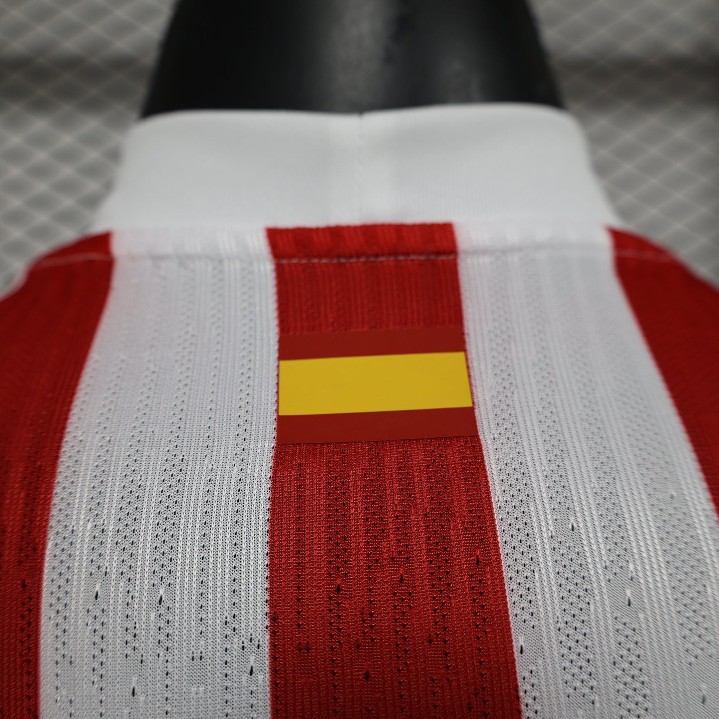 2025/26 Atlético de Madrid Home Player Version Jersey - Red & White Vertical Wide Stripe - White V-Neck Collar - Blue Nike Swoosh - Atlético Crest - Riyadh Air Blue Sponsor