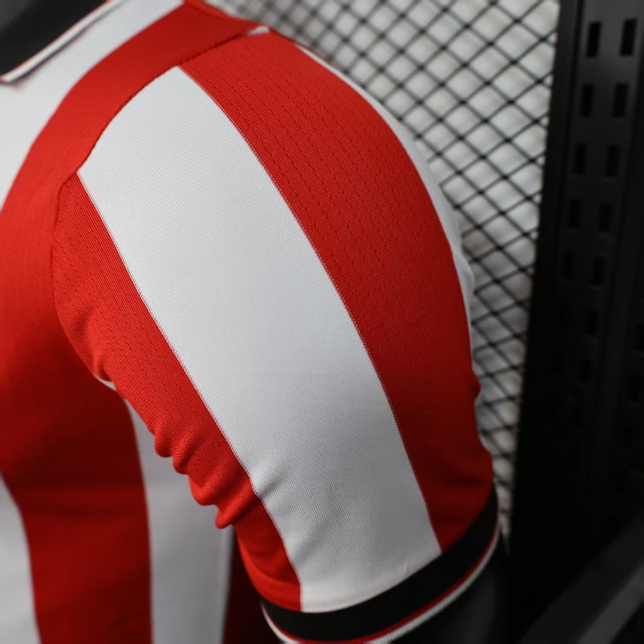 2025/26 Athletic Bilbao Home Player Version Jersey - Red White Vertical Stripe Body Black V-Neck Collar Black Sleeve Cuff Trim - Castore Logo - Athletic Club Official Shield Crest - Kutxabank - Men's