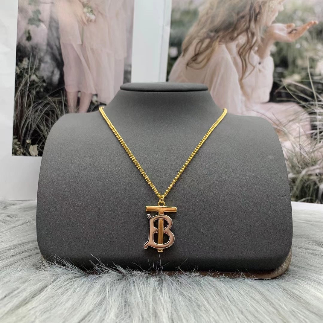 Burberry TB monogram pendant necklace in Gold Tone, detail view 3
