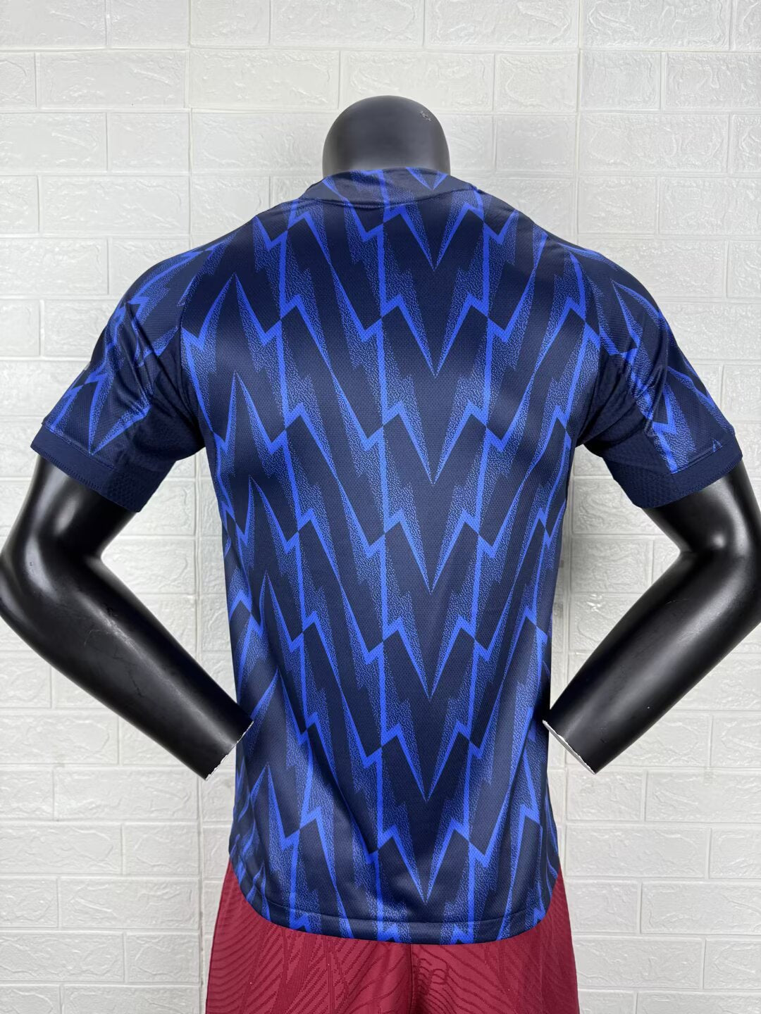 2025/26 Arsenal Away Player Version Jersey - Dark Navy Blue Body All-Over Blue Lightning Bolt Zigzag Graphic - White Three Stripes - Arsenal Cannon Crest - Emirates Fly Better Principal Sponsor