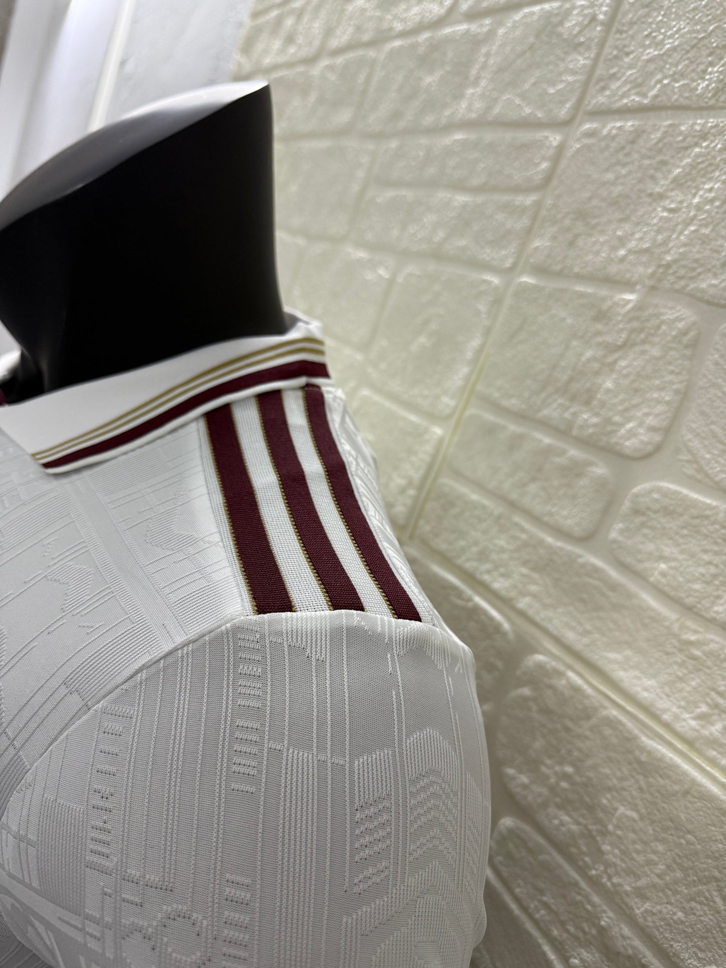 2025/26 Arsenal Third Player Version Jersey - White Body All-Over Subtle Tonal Graphic Texture Deep Maroon Polo Collar Gold Cream Stripe Trim Deep Maroon Sleeve Cuff Trim - Originals Trefoil - Arsenal Cannon Crest - Emirates Fly Better