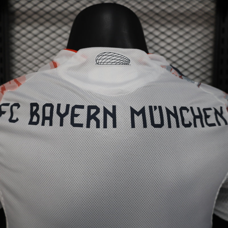 2025/26 Bayern Munich Away Player Version Jersey - White Body Red & Grey Horizontal Brushstroke Graphic - Orange Sleeve Cuffs - Black Adidas Three Stripes - FC Bayern Crest - Deutsche Telekom T Logo