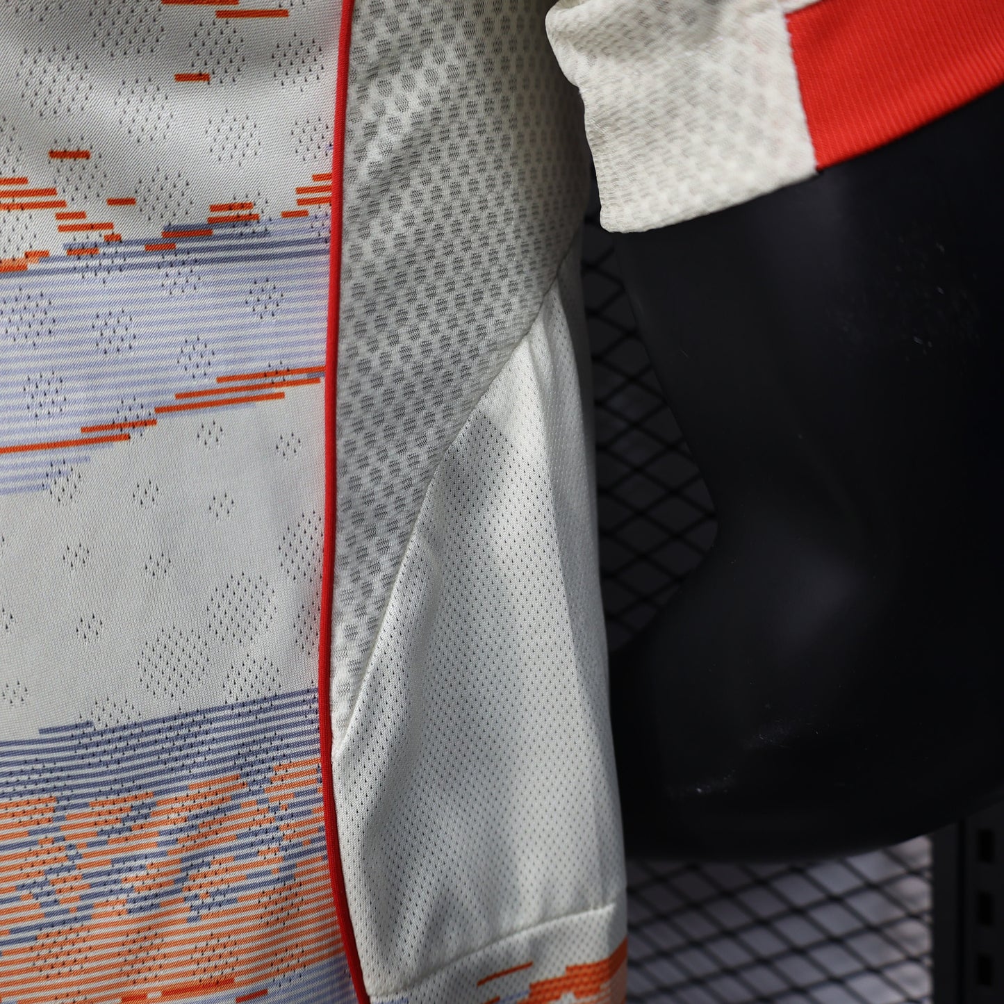 2025/26 Bayern Munich Away Player Version Jersey -  Body Orange Grey Horizontal Brush Stroke Graphic  - Red Side Seam Piping Red Sleeve Cuffs Black Shoulder Stripes - FC Bayern Crest - Deutsche Telekom T Logo
