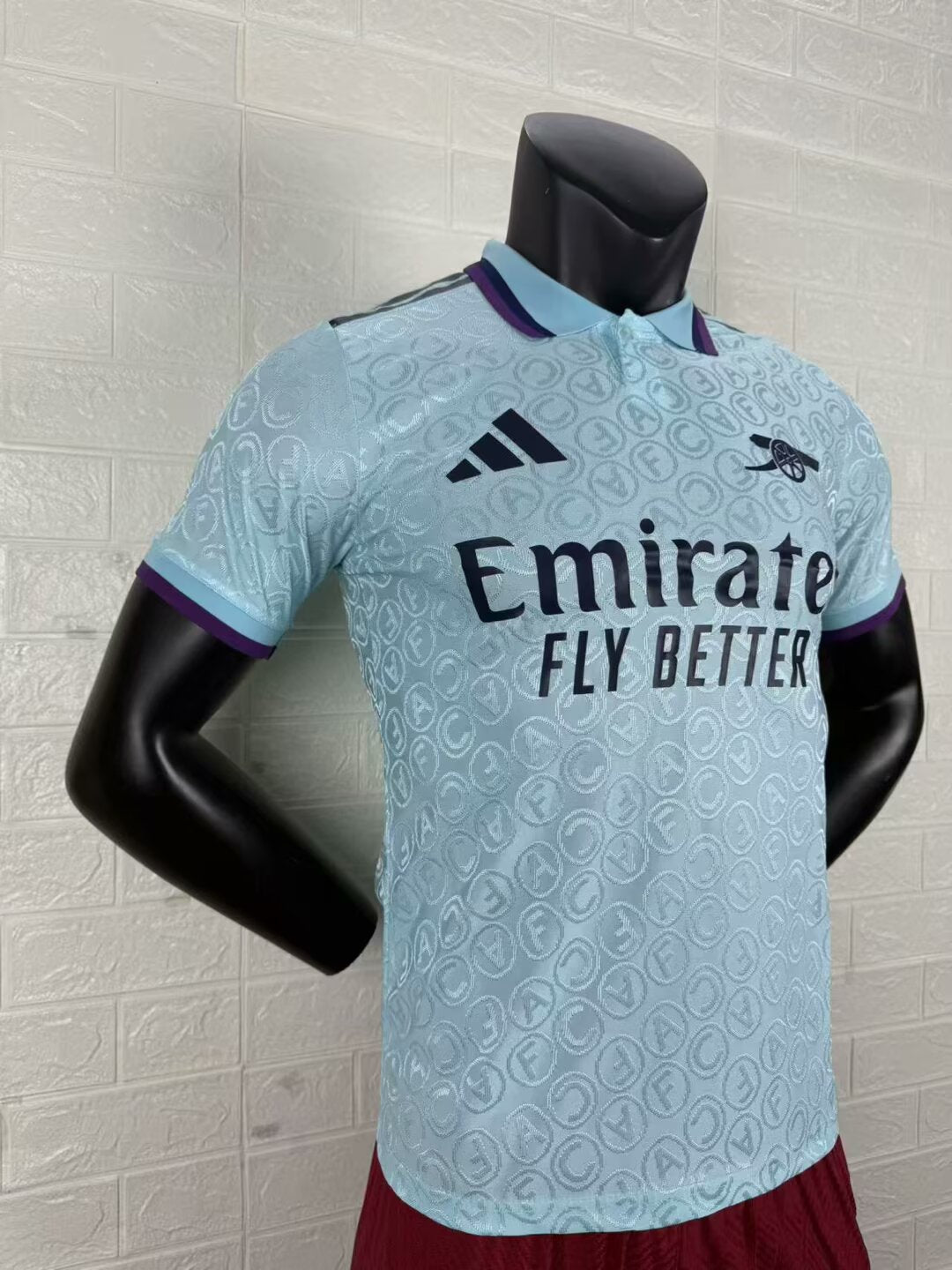 2025/26 Arsenal Special Edition Player Version Jersey - Ice Blue Body All-Over Tonal Cannon Circular Emboss Pattern Deep Purple Polo Collar Deep Purple Sleeve Cuff Trim - Dark Navy Three Stripes - Dark Navy Arsenal Cannon Crest - Emirates Fly Better