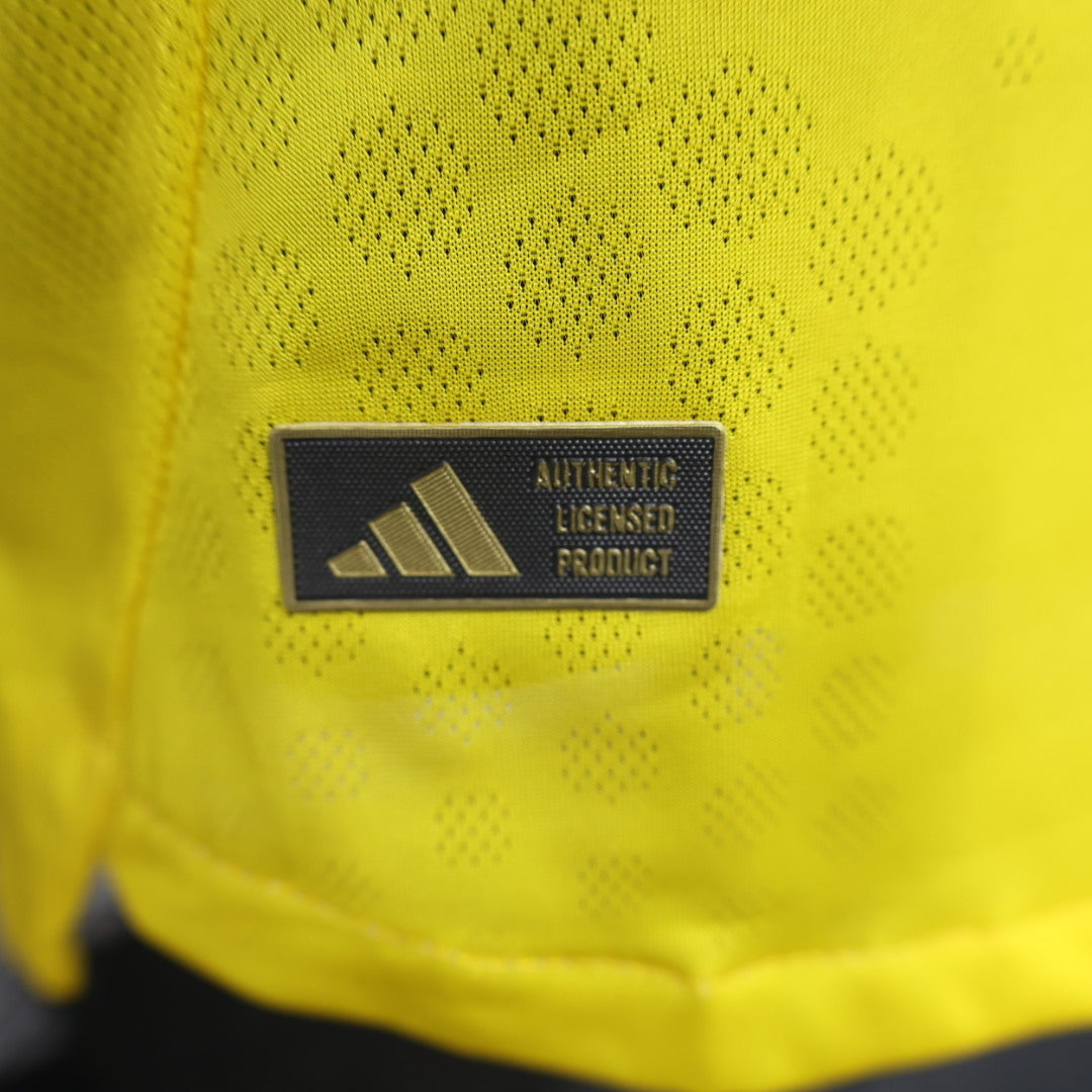 2025/26 Club América Home Player Version Jersey - Yellow Body Black Upper Chest Red Blue Geometric Colour Block Panels - Yellow Three Stripes - Club América Crest - Caliente.mx Principal Sponsor