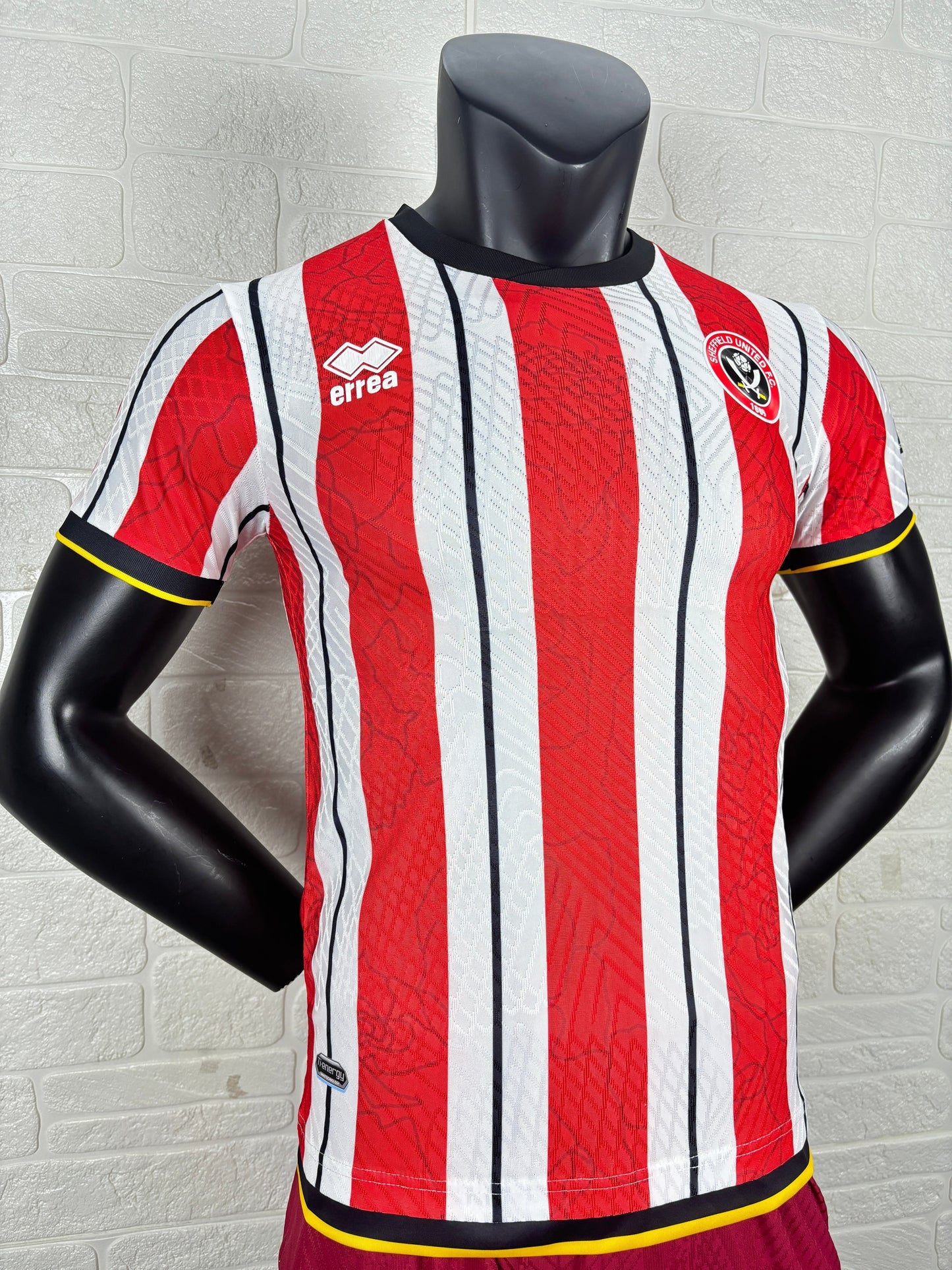 2025/26 Sheffield United Home Player Version Jersey - Erreà - Red White Vertical Wide Stripe - Black Crew Neck Collar - Black Sleeve Cuff & Hem Band with Yellow Piping