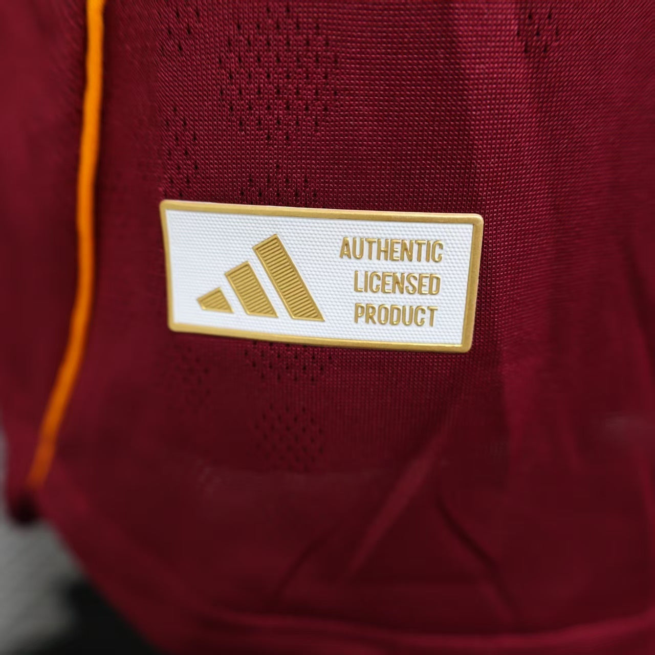 2025/26 AS Roma Home Player Version Jersey - Deep Maroon Body Gold Yellow Side Panel Stripe Seam Detail Gold Yellow Three Stripes - AS Roma Official Shield Crest Gold Yellow Purple She-Wolf Romulus Remus - Men's