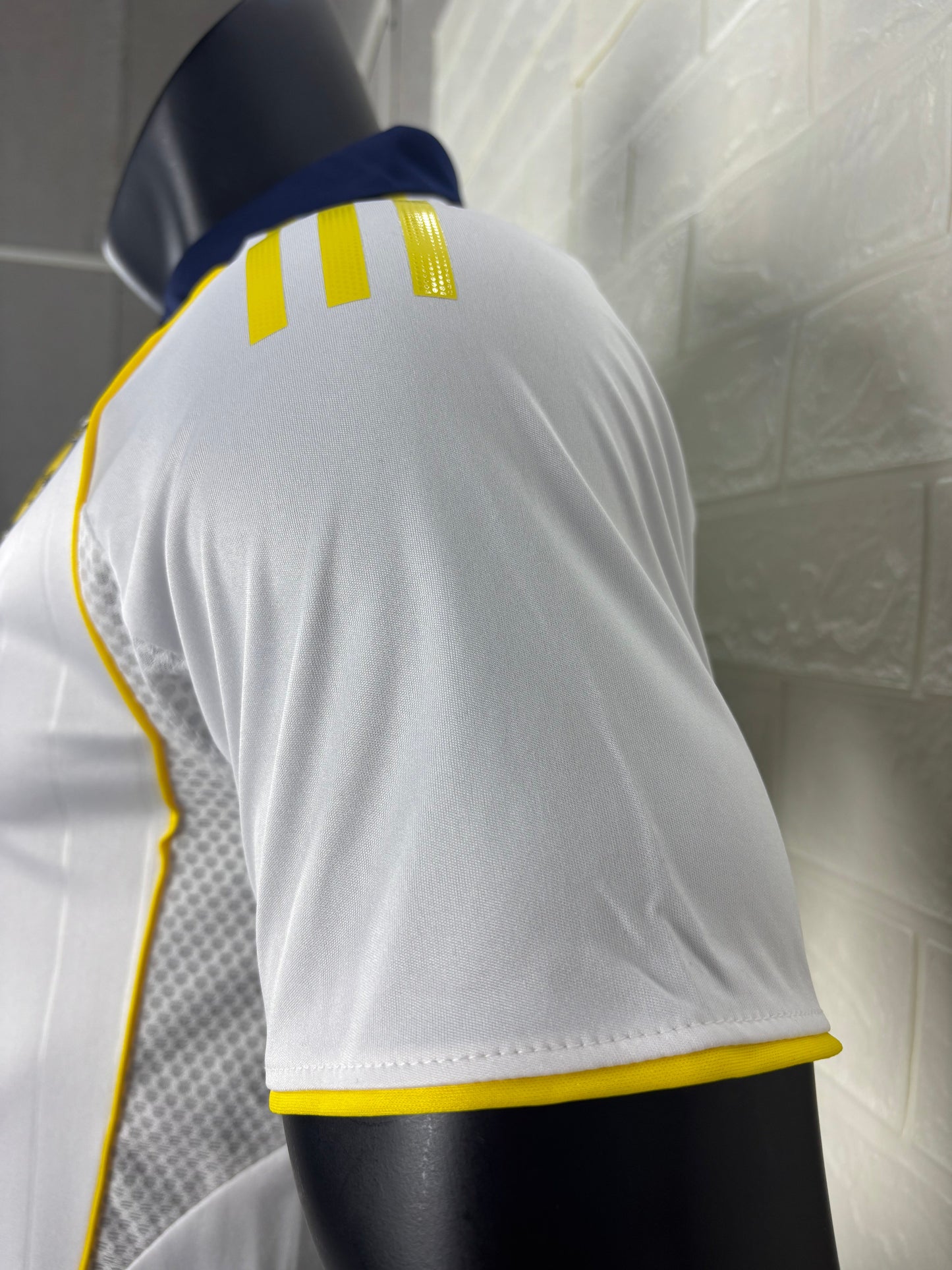 2025/26 Al-Nassr Away Player Version Jersey - White Body - Dark Navy Blue Polo Collar - Gold Yellow Side Seam Piping - KAFD Gold Yellow Sponsor