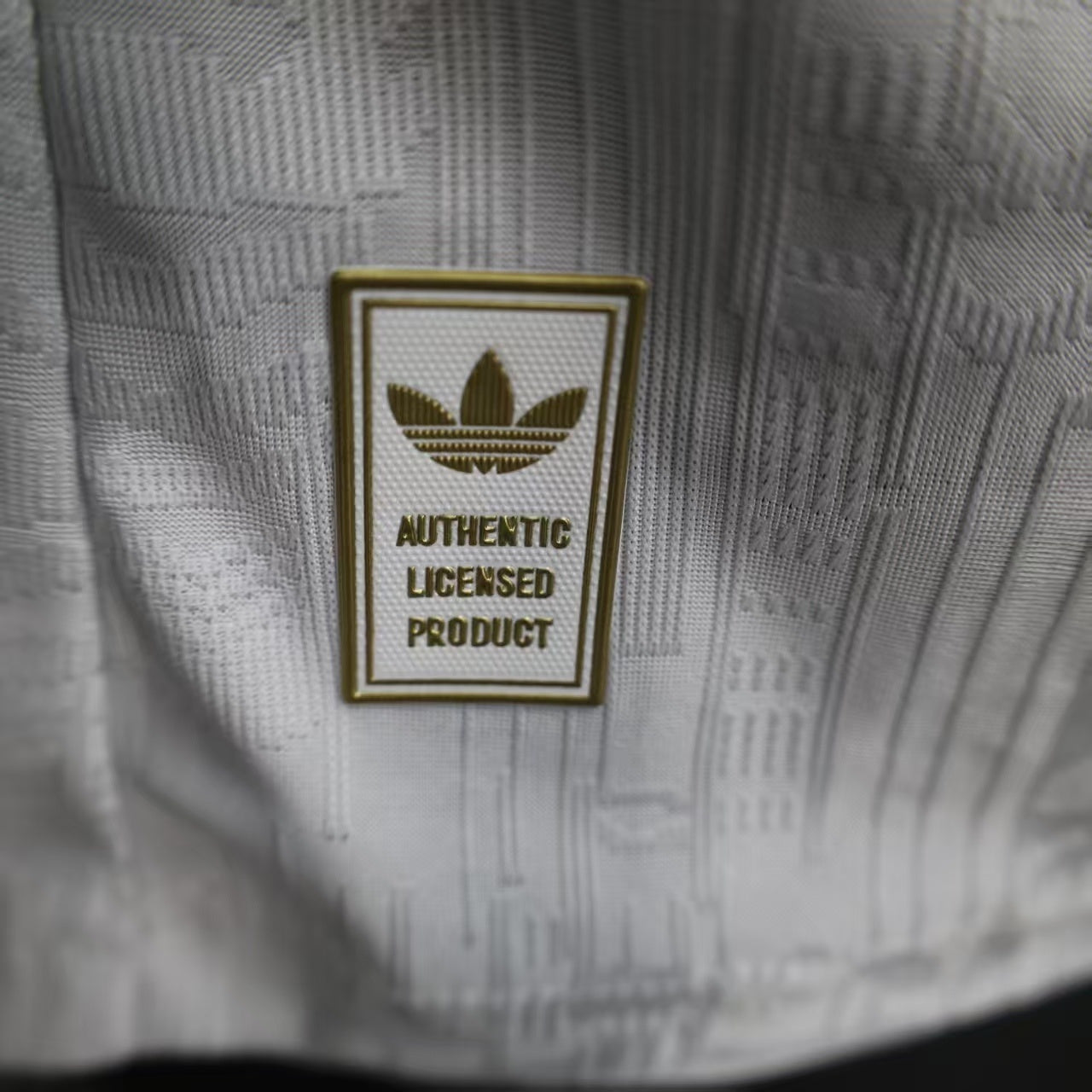 2025/26 Arsenal Away Player Version Jersey - White Body All-Over Subtle Tonal Graphic Texture Deep Maroon Polo Collar Gold Cream Stripe Trim - Originals Trefoil - Arsenal Cannon Crest - Emirates Fly Better - Men's