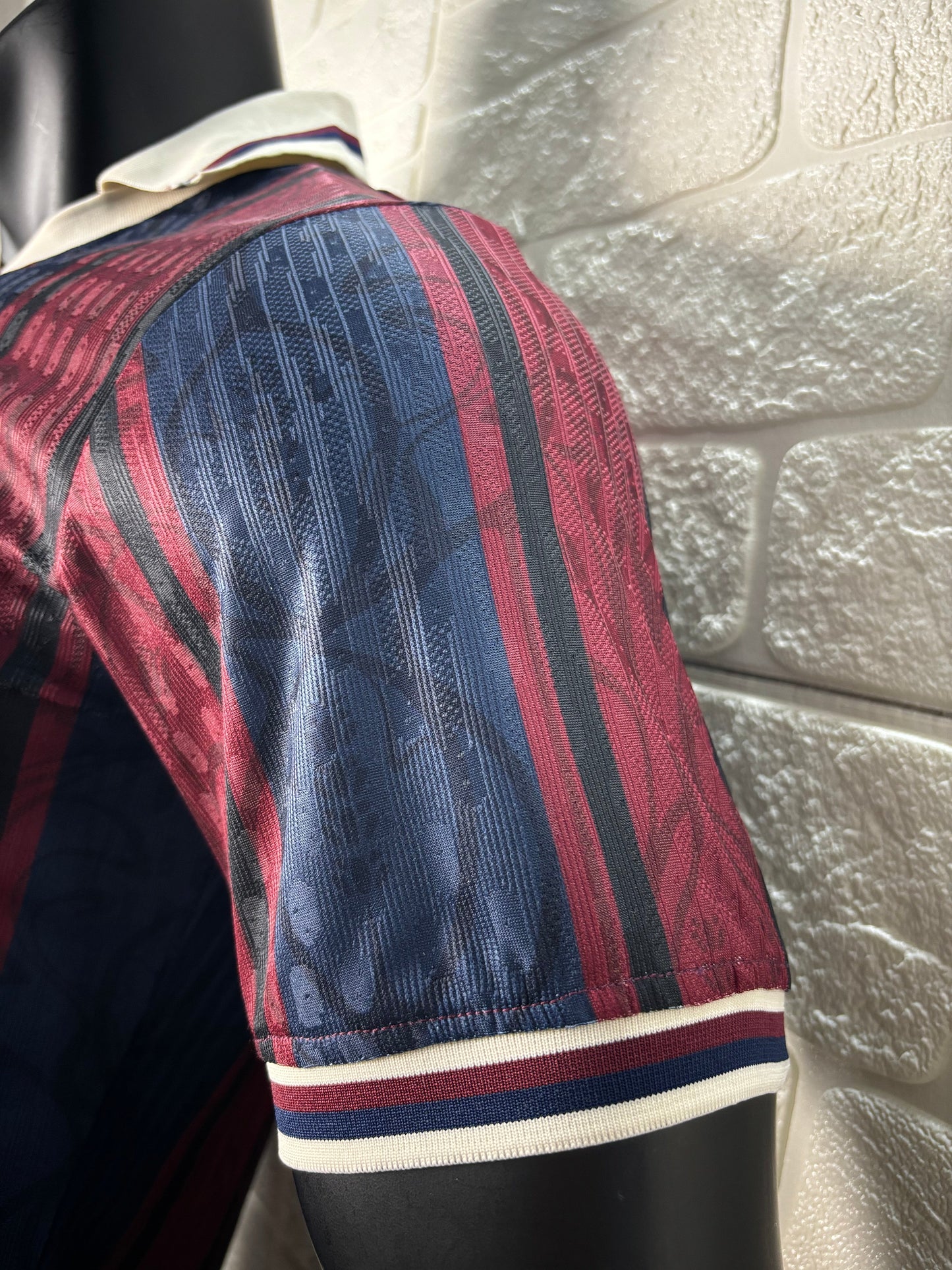 2025/26 FC Barcelona 125th Anniversary Edition Player Version Jersey - Dark Navy Blue & Deep Red Vertical Stripe - White V-Neck Collar - Gold Barça Script - Vintage FCB Crest - Clean Chest
