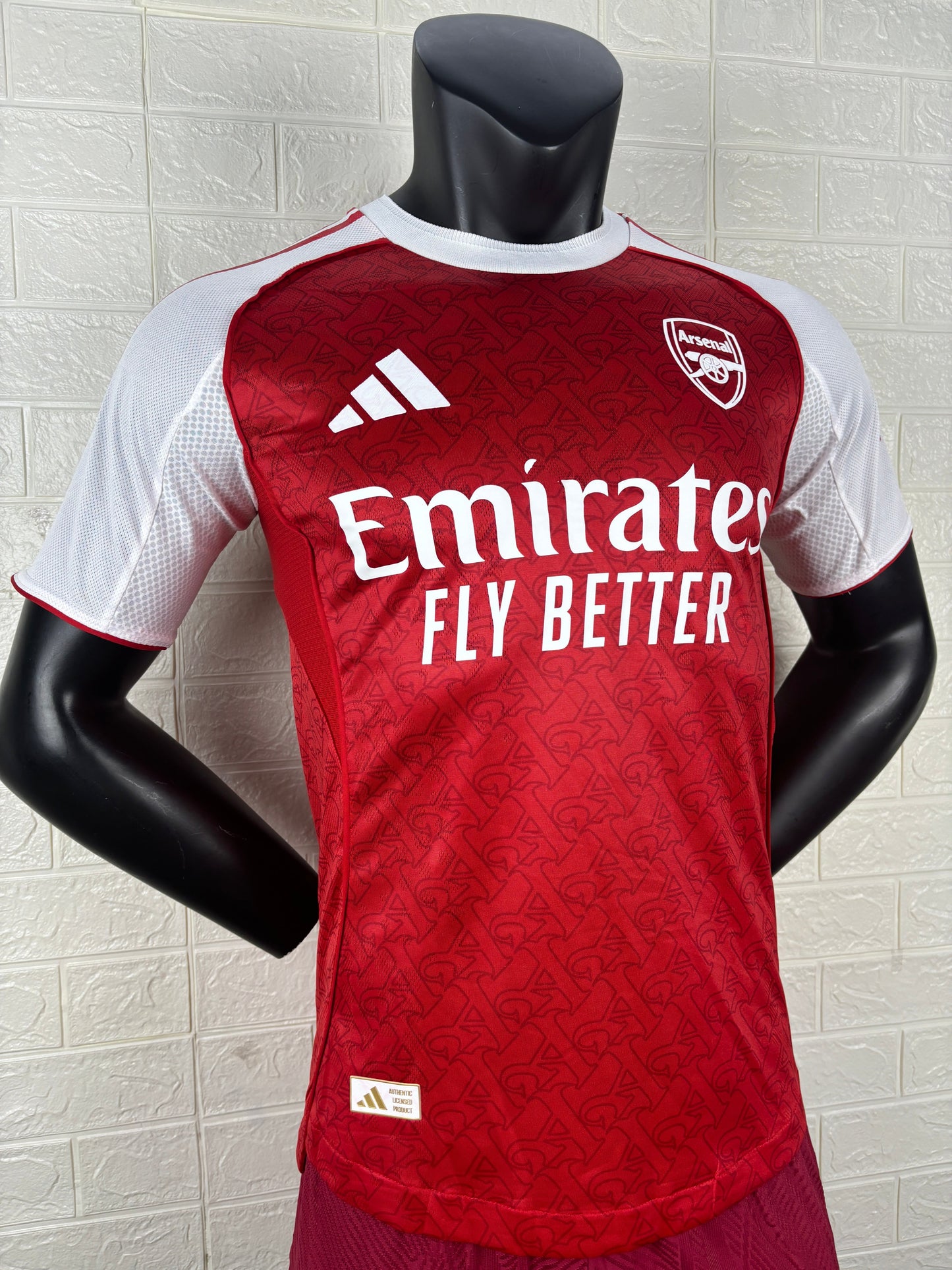 2025/26 Arsenal Home Player Version Jersey - Red Body White Sleeves Diamond Mesh Texture Red Side Seam Piping - White Three Stripes Left Chest - Arsenal Shield Crest Right Chest - Emirates Fly Better Principal Sponsor