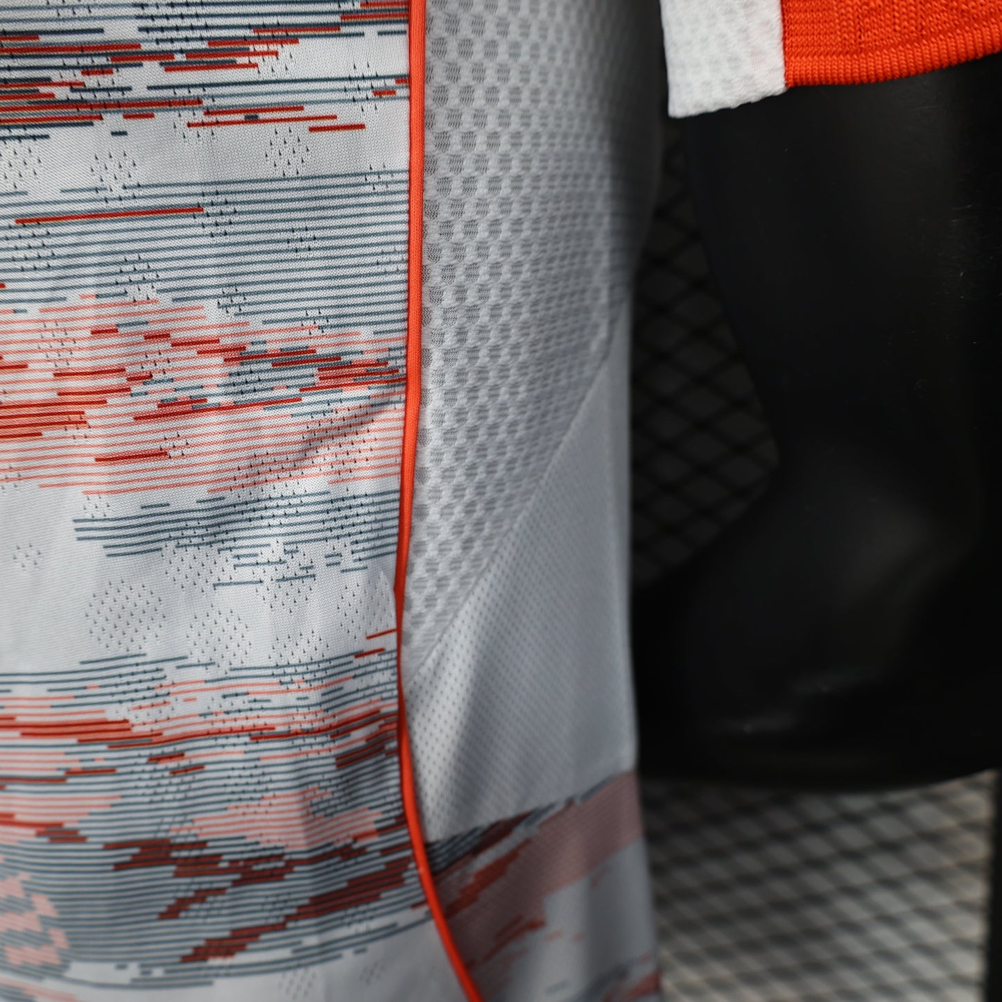 2025/26 Bayern Munich Away Player Version Jersey - White Body Red & Grey Horizontal Brushstroke Graphic - Orange Sleeve Cuffs - Black Adidas Three Stripes - FC Bayern Crest - Deutsche Telekom T Logo