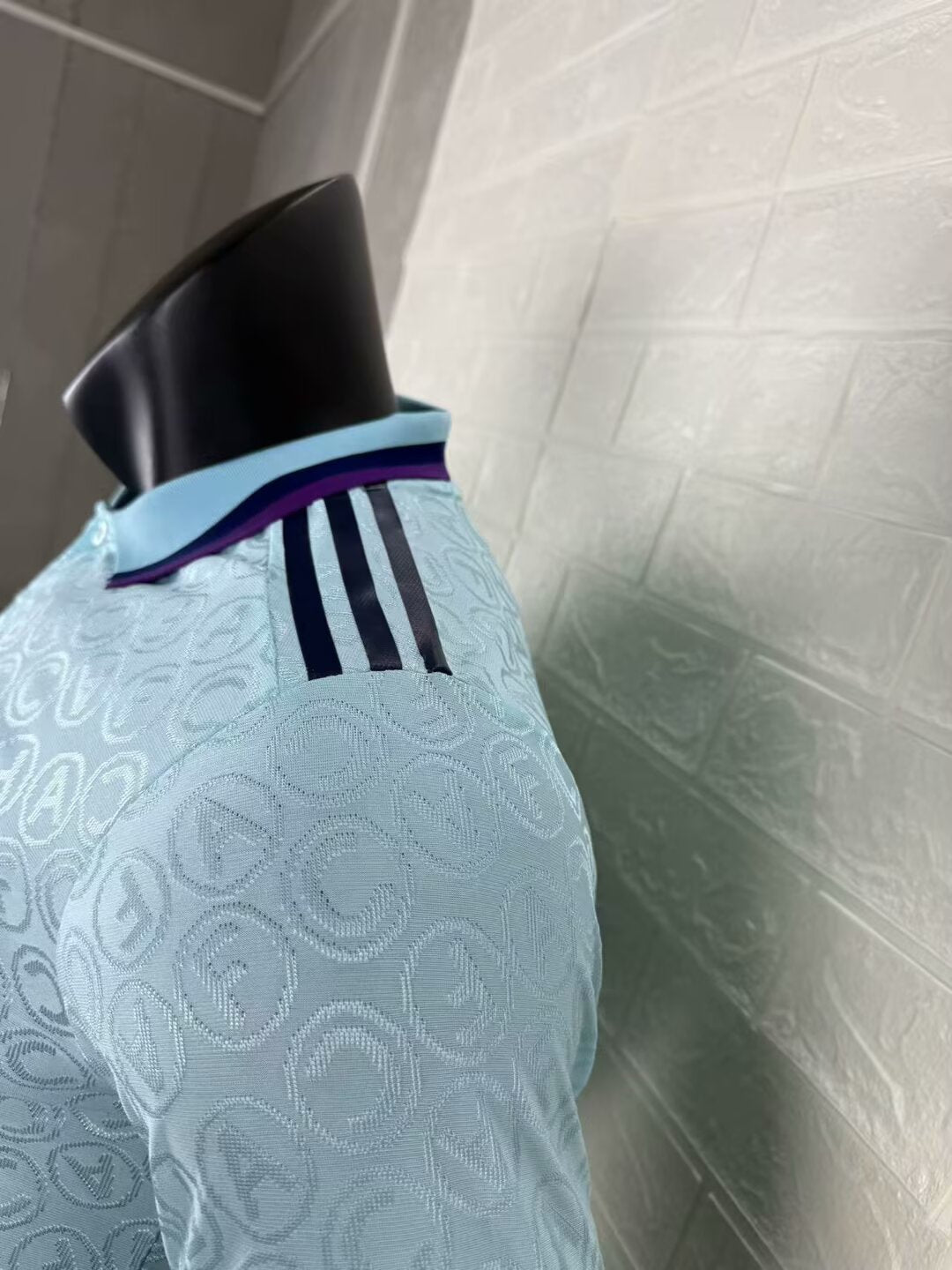 2025/26 Arsenal Special Edition Player Version Jersey - Ice Blue Body All-Over Tonal Cannon Circular Emboss Pattern Deep Purple Polo Collar Deep Purple Sleeve Cuff Trim - Dark Navy Three Stripes - Dark Navy Arsenal Cannon Crest - Emirates Fly Better