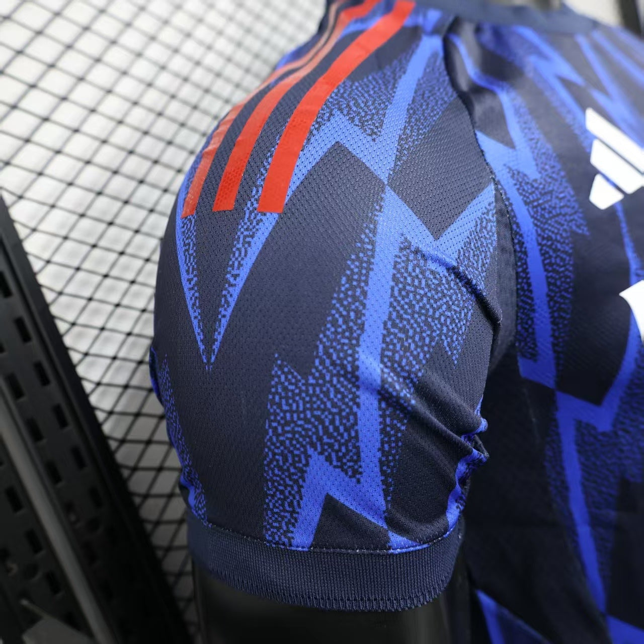 2025/26 Arsenal Away Player Version Jersey - Dark Navy Blue Body All-Over Blue Lightning Bolt Zigzag Graphic Red Sleeve Cuff Trim - White Three Stripes - Arsenal Cannon Crest - Emirates Fly Better - Men's