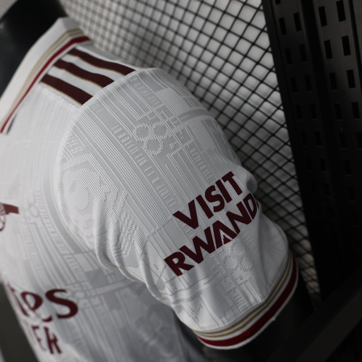 2025/26 Arsenal Away Player Version Jersey - White Body All-Over Subtle Tonal Graphic Texture Deep Maroon Polo Collar Multi-Stripe Gold Red White Trim - Originals Trefoil - Arsenal Cannon Crest - Emirates Fly Better - Men's