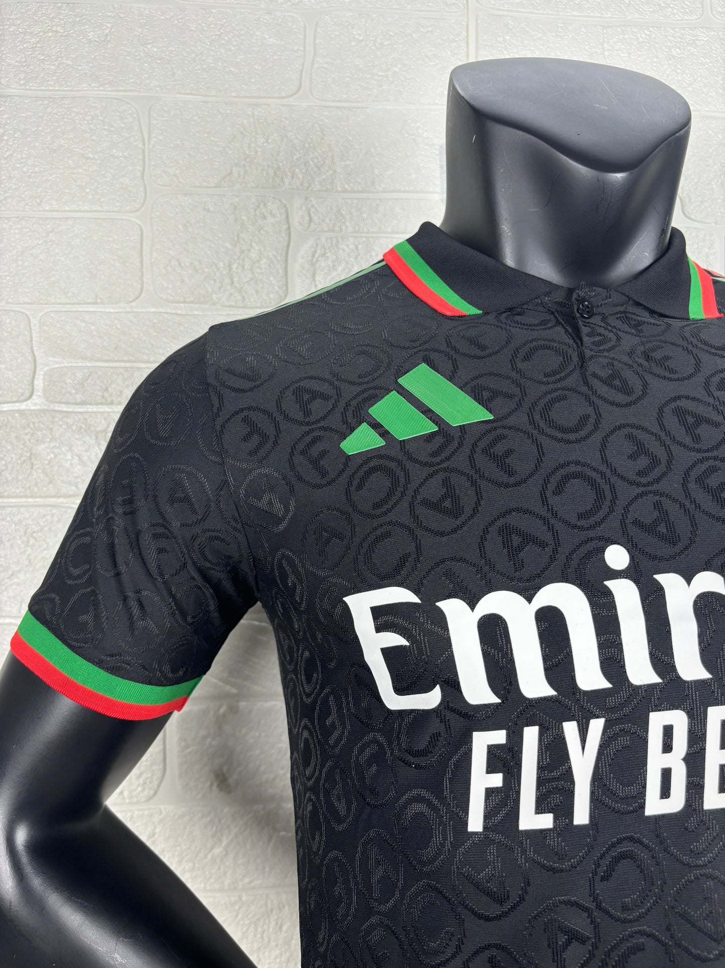 2025/26 Arsenal Special Edition Black Player Version Jersey - Black Body All-Over Tonal Cannon Circular Emboss Pattern Black Polo Collar Green Red Double Stripe Trim - Green Three Stripes - Red Arsenal Cannon Crest - Emirates Fly Better