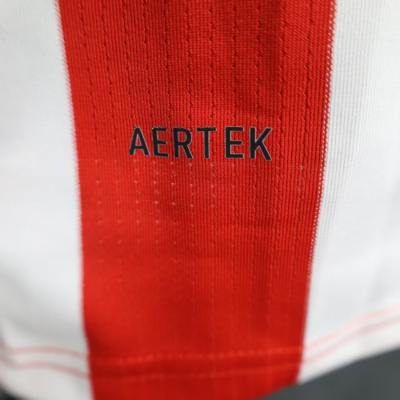 2025/26 Athletic Bilbao Home Player Version Jersey - Red White Vertical Stripe Body Black V-Neck Collar Black Sleeve Cuff Trim - Castore Logo - Athletic Club Official Shield Crest - Kutxabank - Men's