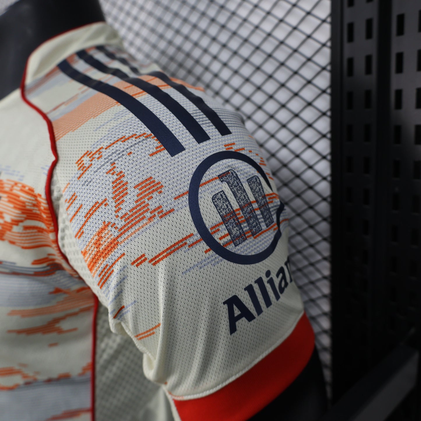 2025/26 Bayern Munich Away Player Version Jersey -  Body Orange Grey Horizontal Brush Stroke Graphic  - Red Side Seam Piping Red Sleeve Cuffs Black Shoulder Stripes - FC Bayern Crest - Deutsche Telekom T Logo