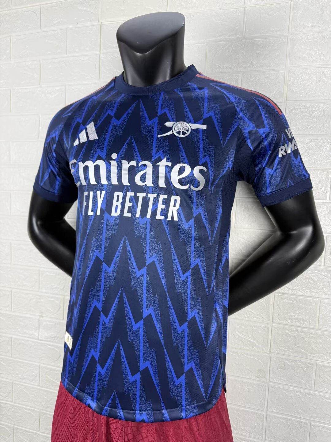 2025/26 Arsenal Away Player Version Jersey - Dark Navy Blue Body All-Over Blue Lightning Bolt Zigzag Graphic - White Three Stripes - Arsenal Cannon Crest - Emirates Fly Better Principal Sponsor
