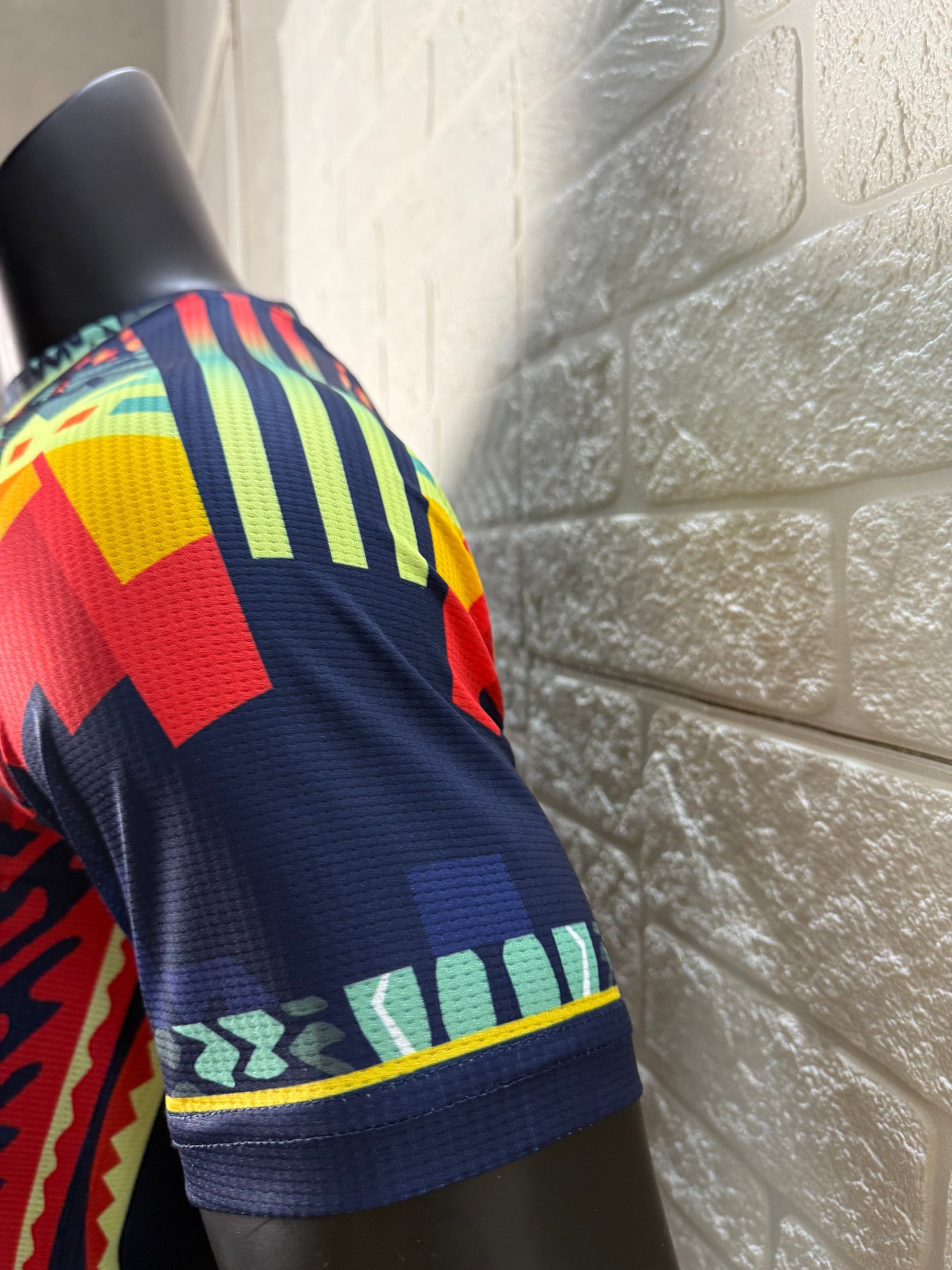 2025/26 Club América Training Player Version Jersey - Dark Navy Blue Body Multicolour Aztec Zigzag Graphic Upper Chest -Gold Three Stripes - Club América Crest - Caliente Principal Sponsor