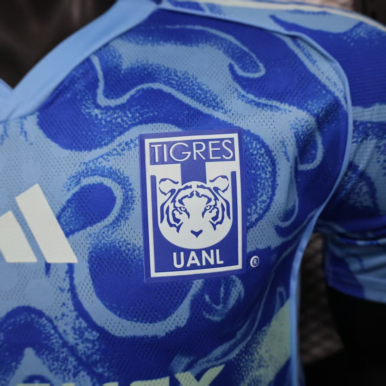 2025/26 Tigres UANL Away Player Version Jersey - Royal Blue Body - All-Over Tiger Face Tonal Graphic Print - Blue V-Neck Collar - CEMEX White Sponsor