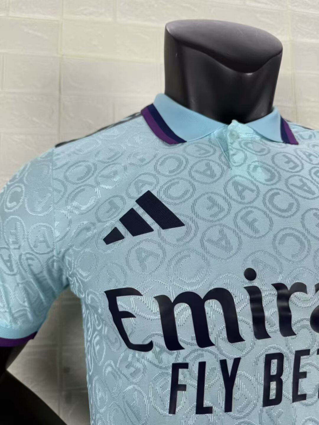 2025/26 Arsenal Special Edition Player Version Jersey - Ice Blue Body All-Over Tonal Cannon Circular Emboss Pattern Deep Purple Polo Collar Deep Purple Sleeve Cuff Trim - Dark Navy Three Stripes - Dark Navy Arsenal Cannon Crest - Emirates Fly Better