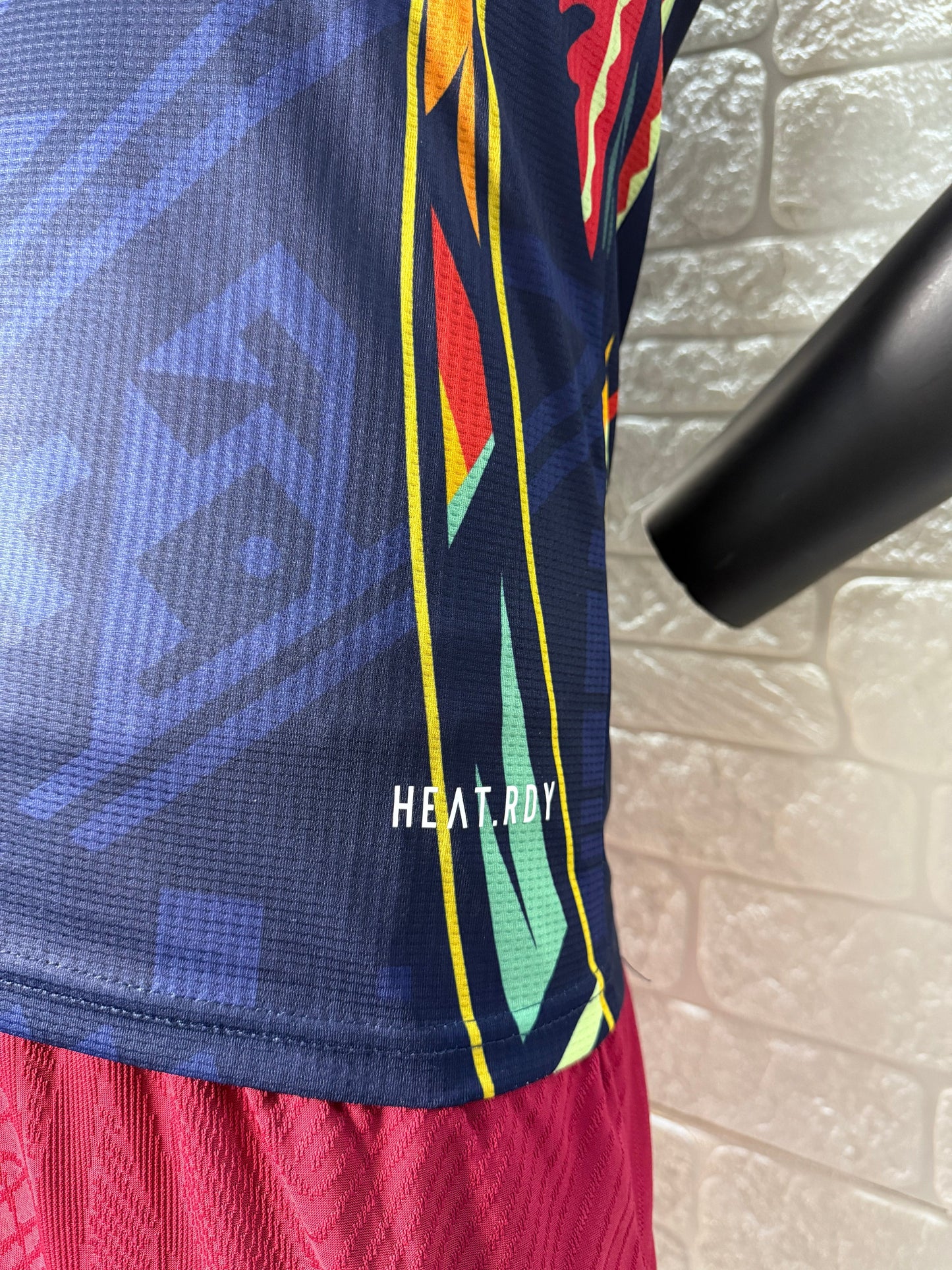 2025/26 Club América Training Player Version Jersey - Dark Navy Blue Body Multicolour Aztec Zigzag Graphic Upper Chest -Gold Three Stripes - Club América Crest - Caliente Principal Sponsor