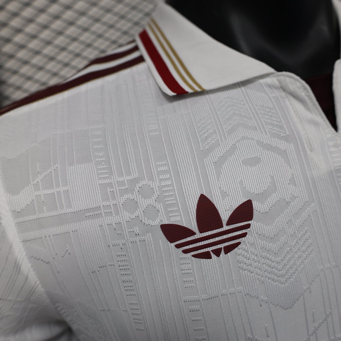 2025/26 Arsenal Away Player Version Jersey - White Body All-Over Subtle Tonal Graphic Texture Deep Maroon Polo Collar Multi-Stripe Gold Red White Trim - Originals Trefoil - Arsenal Cannon Crest - Emirates Fly Better - Men's