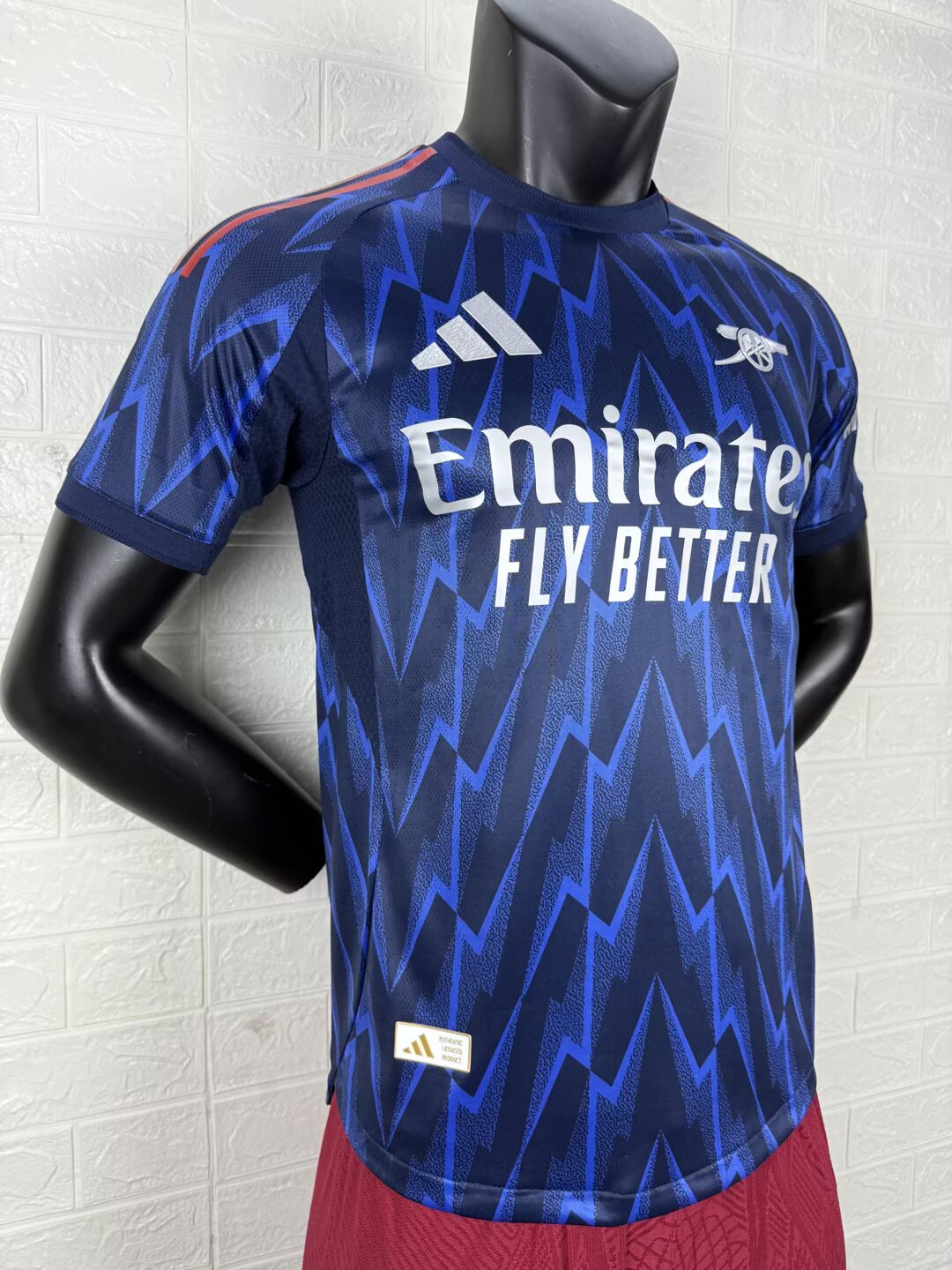 2025/26 Arsenal Away Player Version Jersey - Dark Navy Blue Body All-Over Blue Lightning Bolt Zigzag Graphic - White Three Stripes - Arsenal Cannon Crest - Emirates Fly Better Principal Sponsor