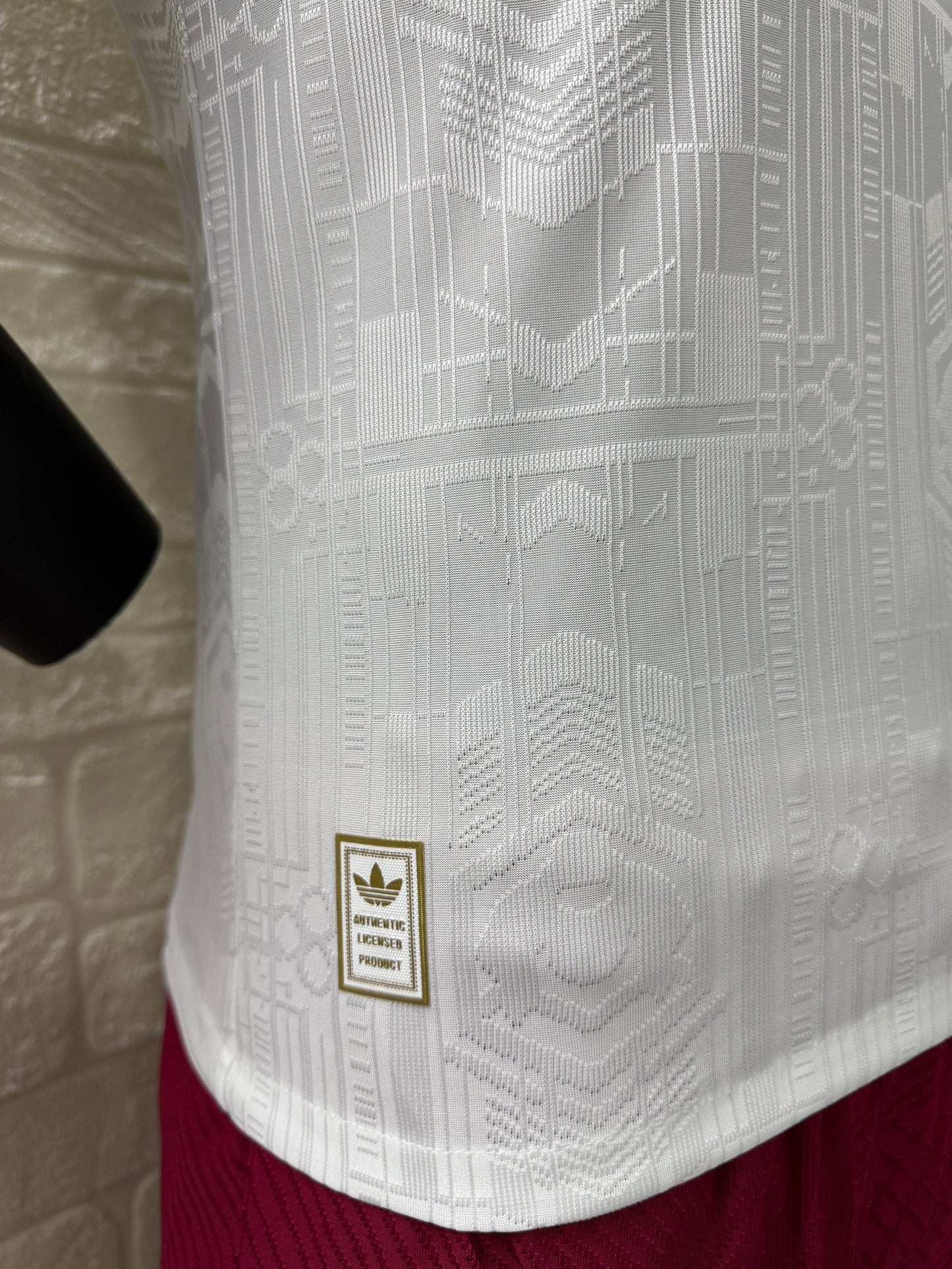 2025/26 Arsenal Third Player Version Jersey - White Body All-Over Subtle Tonal Graphic Texture Deep Maroon Polo Collar Gold Cream Stripe Trim Deep Maroon Sleeve Cuff Trim - Originals Trefoil - Arsenal Cannon Crest - Emirates Fly Better