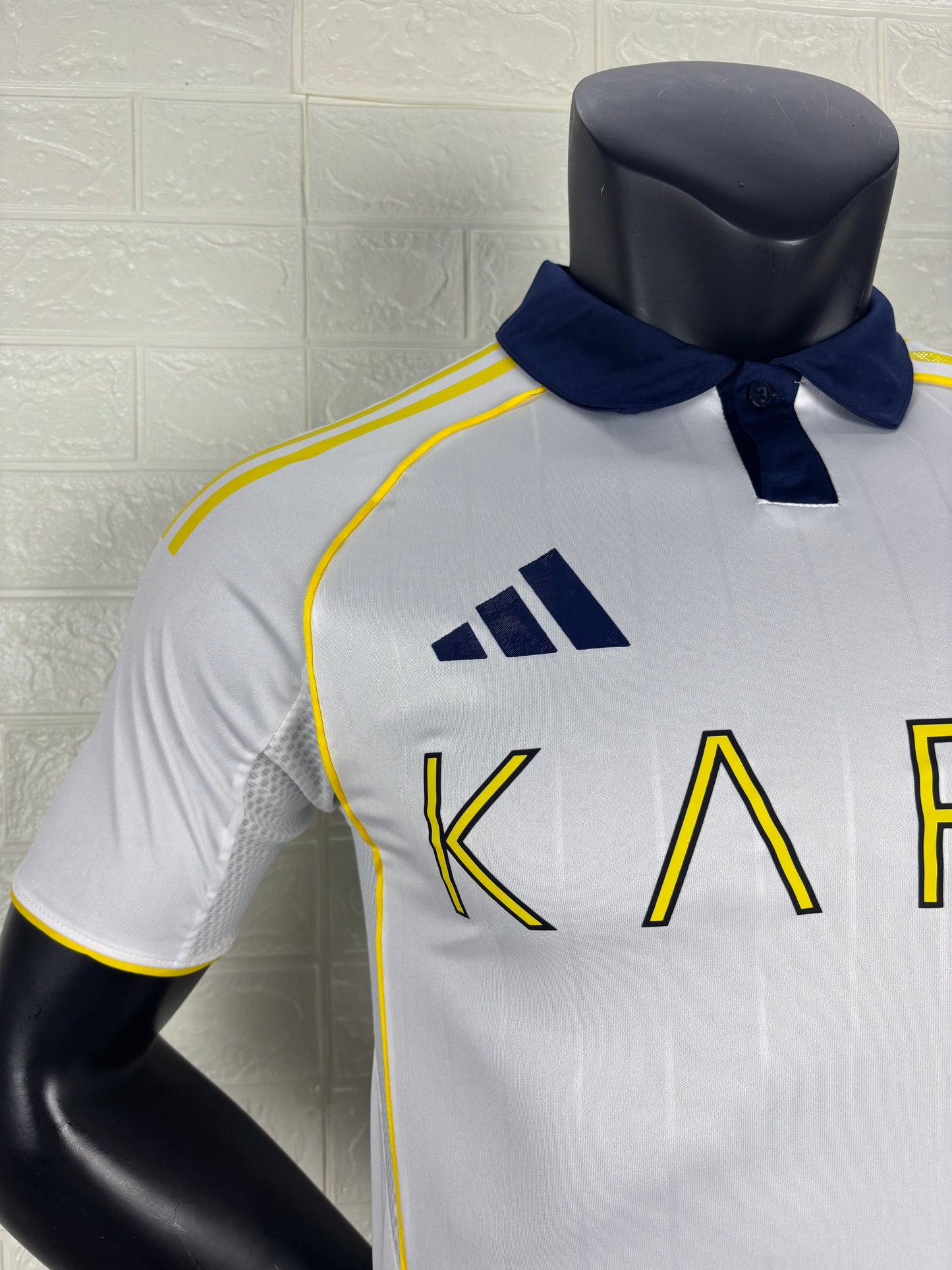 2025/26 Al-Nassr Away Player Version Jersey - White Body - Dark Navy Blue Polo Collar - Gold Yellow Side Seam Piping - KAFD Gold Yellow Sponsor