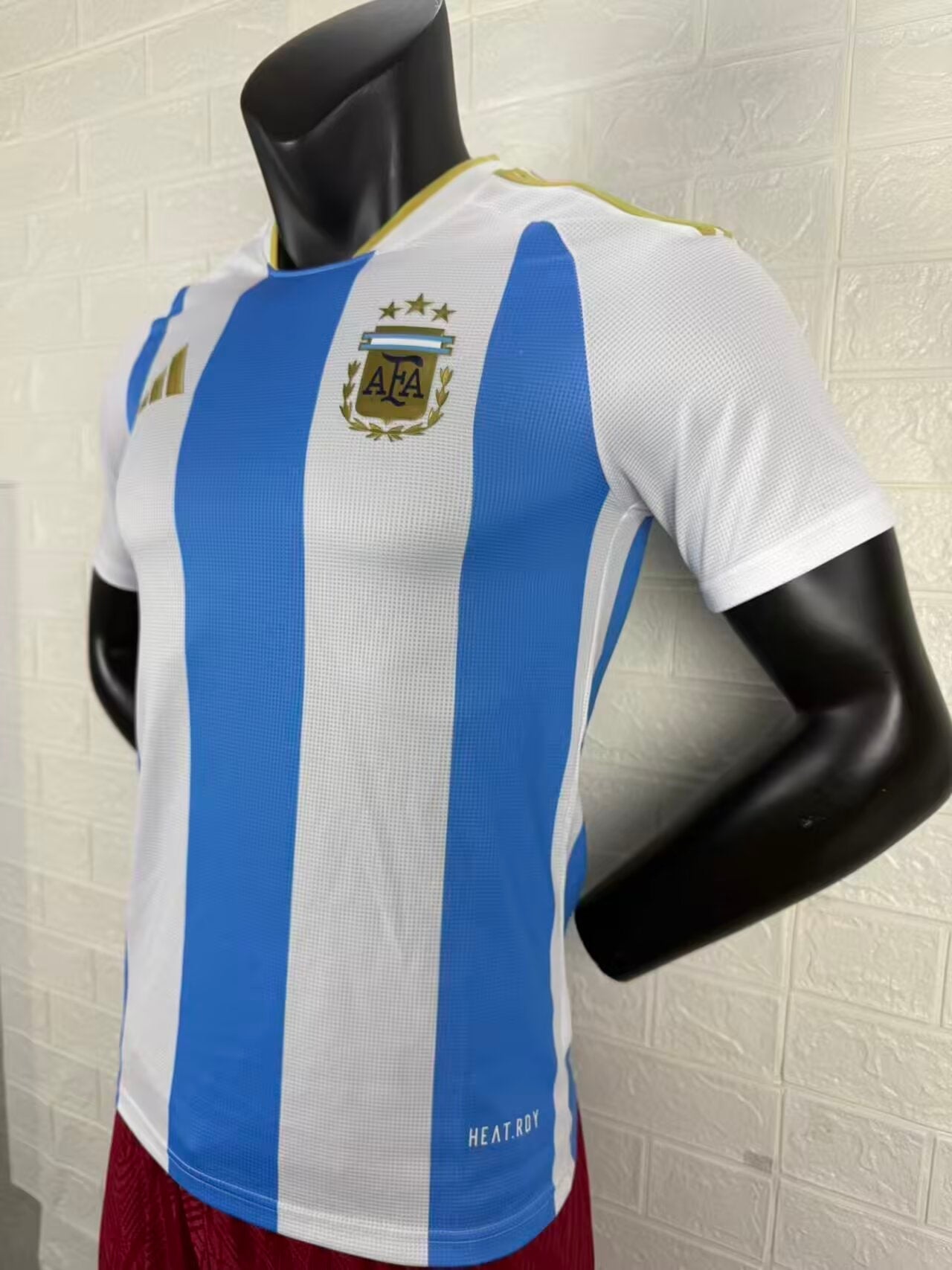 2025/26 Argentina Home Player Version Jersey - White Body Wide Sky Blue Central Vertical Stripe Fine Grid Texture Three Gold Stars Gold Collar Trim - Gold Three Stripes - AFA Square Crest