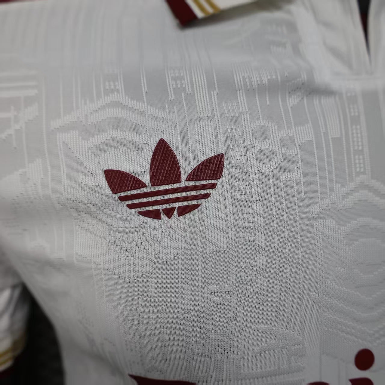 2025/26 Arsenal Away Player Version Jersey - White Body All-Over Subtle Tonal Graphic Texture Deep Maroon Polo Collar Gold Cream Stripe Trim - Originals Trefoil - Arsenal Cannon Crest - Emirates Fly Better - Men's