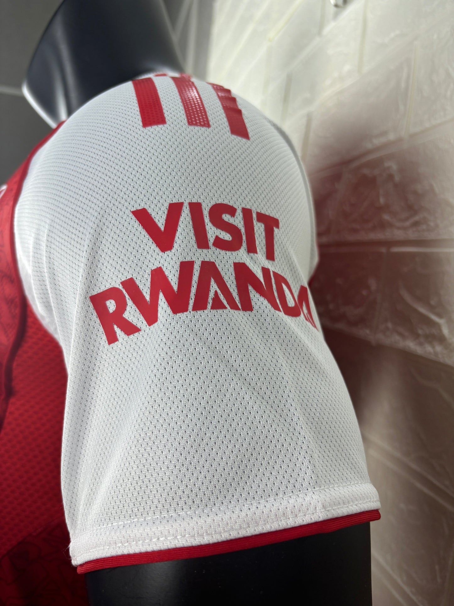 2025/26 Arsenal Home Player Version Jersey - Red Body White Sleeves Diamond Mesh Texture Red Side Seam Piping - White Three Stripes Left Chest - Arsenal Shield Crest Right Chest - Emirates Fly Better Principal Sponsor