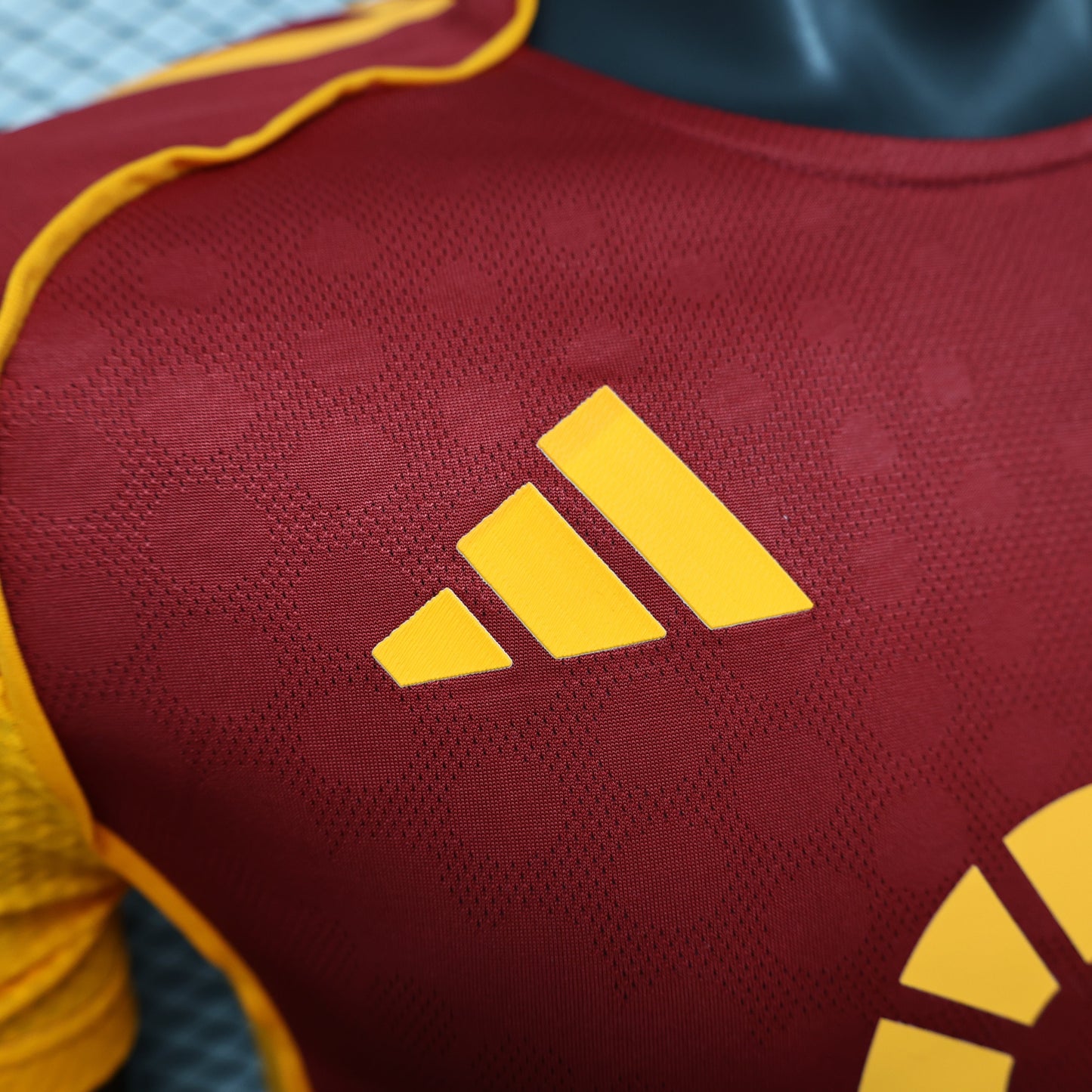 2025/26 AS Roma Home Player Version Jersey - Claret Dark Red Body - Gold Yellow Side Panels & Sleeves - Riyadh Season Gold Yellow Sponsor
