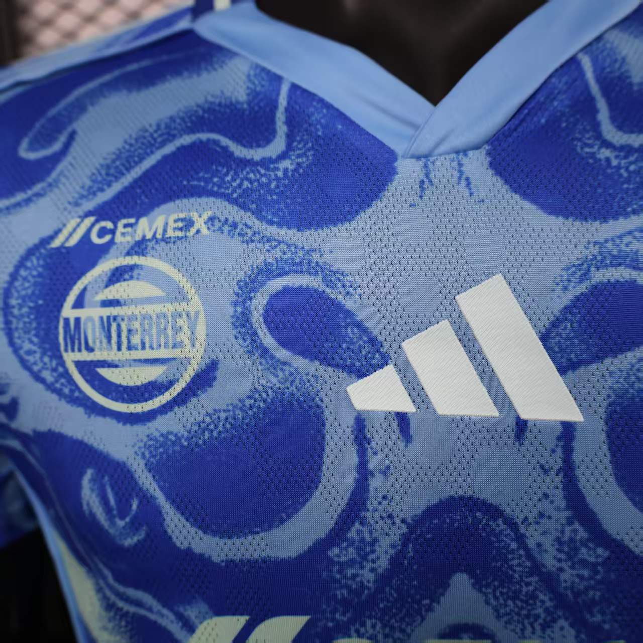 2025/26 Tigres UANL Away Player Version Jersey - Royal Blue Body - All-Over Tiger Face Tonal Graphic Print - Blue V-Neck Collar - CEMEX White Sponsor