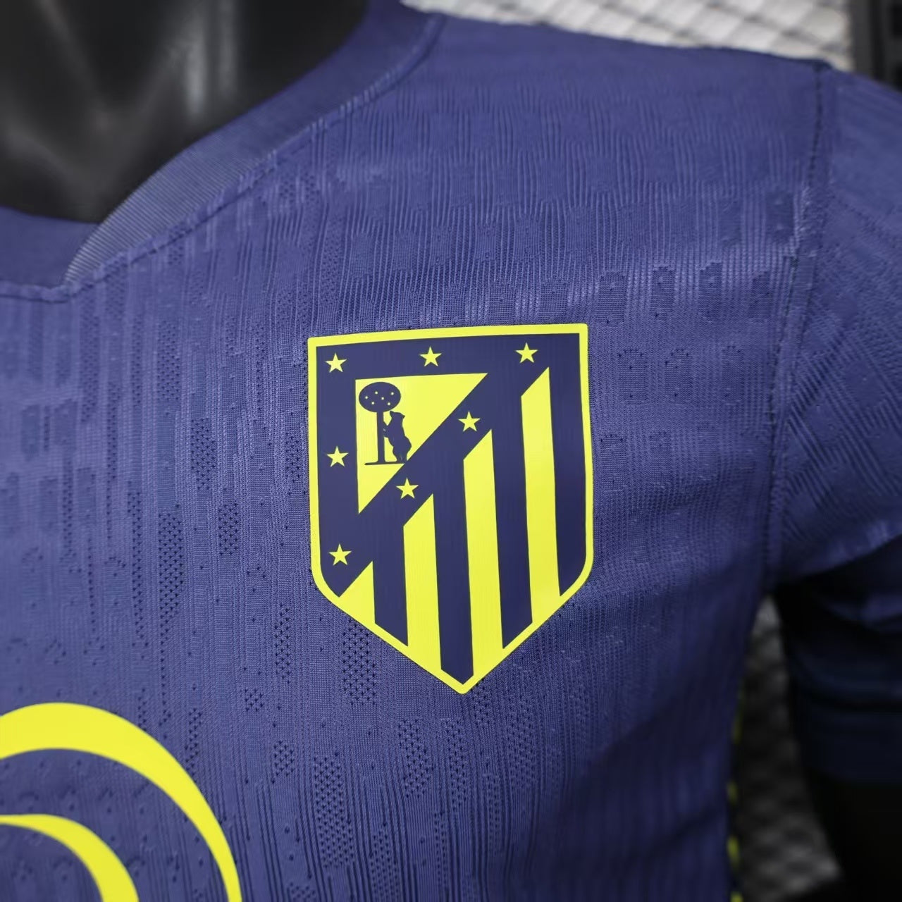 2025/26 Atlético Madrid Away Player Version Jersey - Deep Purple-Navy Body All-Over Subtle Geometric Tonal Texture Deep Purple-Navy V-Neck Collar - Nike Volt Yellow-Green Swoosh - Atlético Madrid Official Shield Crest Volt Yellow-Green
