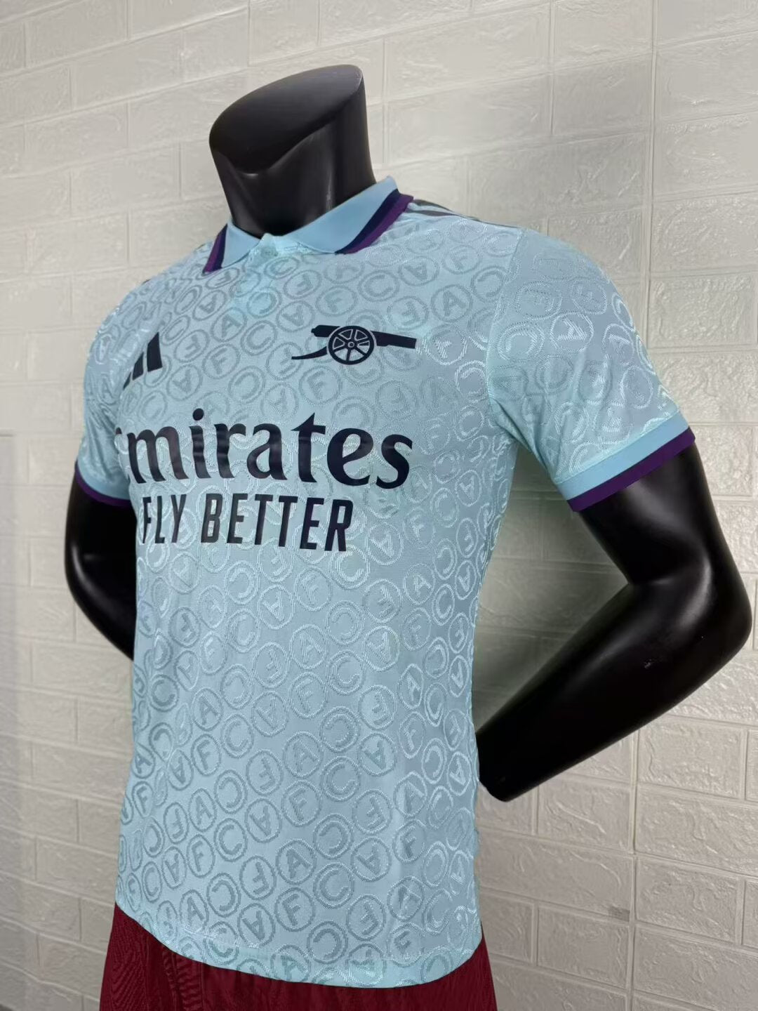 2025/26 Arsenal Special Edition Player Version Jersey - Ice Blue Body All-Over Tonal Cannon Circular Emboss Pattern Deep Purple Polo Collar Deep Purple Sleeve Cuff Trim - Dark Navy Three Stripes - Dark Navy Arsenal Cannon Crest - Emirates Fly Better