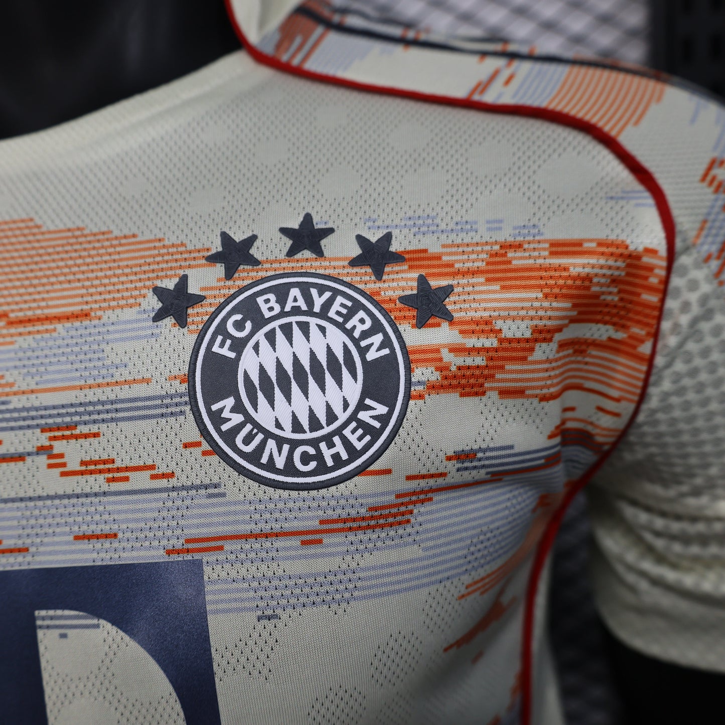 2025/26 Bayern Munich Away Player Version Jersey -  Body Orange Grey Horizontal Brush Stroke Graphic  - Red Side Seam Piping Red Sleeve Cuffs Black Shoulder Stripes - FC Bayern Crest - Deutsche Telekom T Logo