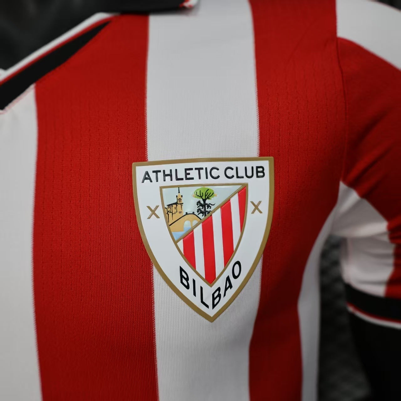 2025/26 Athletic Bilbao Home Player Version Jersey - Red White Vertical Stripe Body Black V-Neck Collar Black Sleeve Cuff Trim - Castore Logo - Athletic Club Official Shield Crest - Kutxabank - Men's