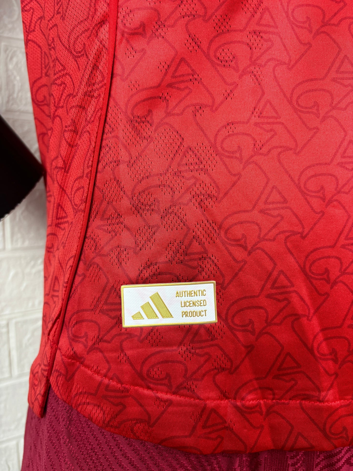 2025/26 Arsenal Home Player Version Jersey - Red Body White Sleeves Diamond Mesh Texture Red Side Seam Piping - White Three Stripes Left Chest - Arsenal Shield Crest Right Chest - Emirates Fly Better Principal Sponsor