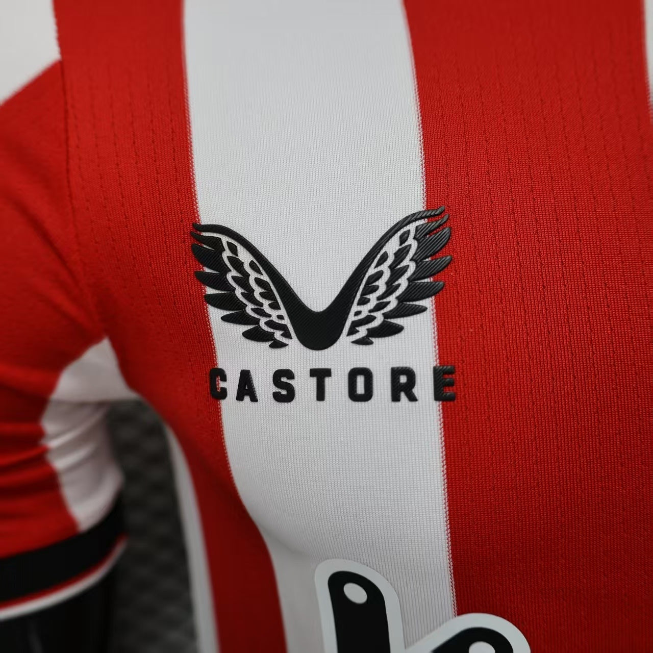 2025/26 Athletic Bilbao Home Player Version Jersey - Red White Vertical Stripe Body Black V-Neck Collar Black Sleeve Cuff Trim - Castore Logo - Athletic Club Official Shield Crest - Kutxabank - Men's