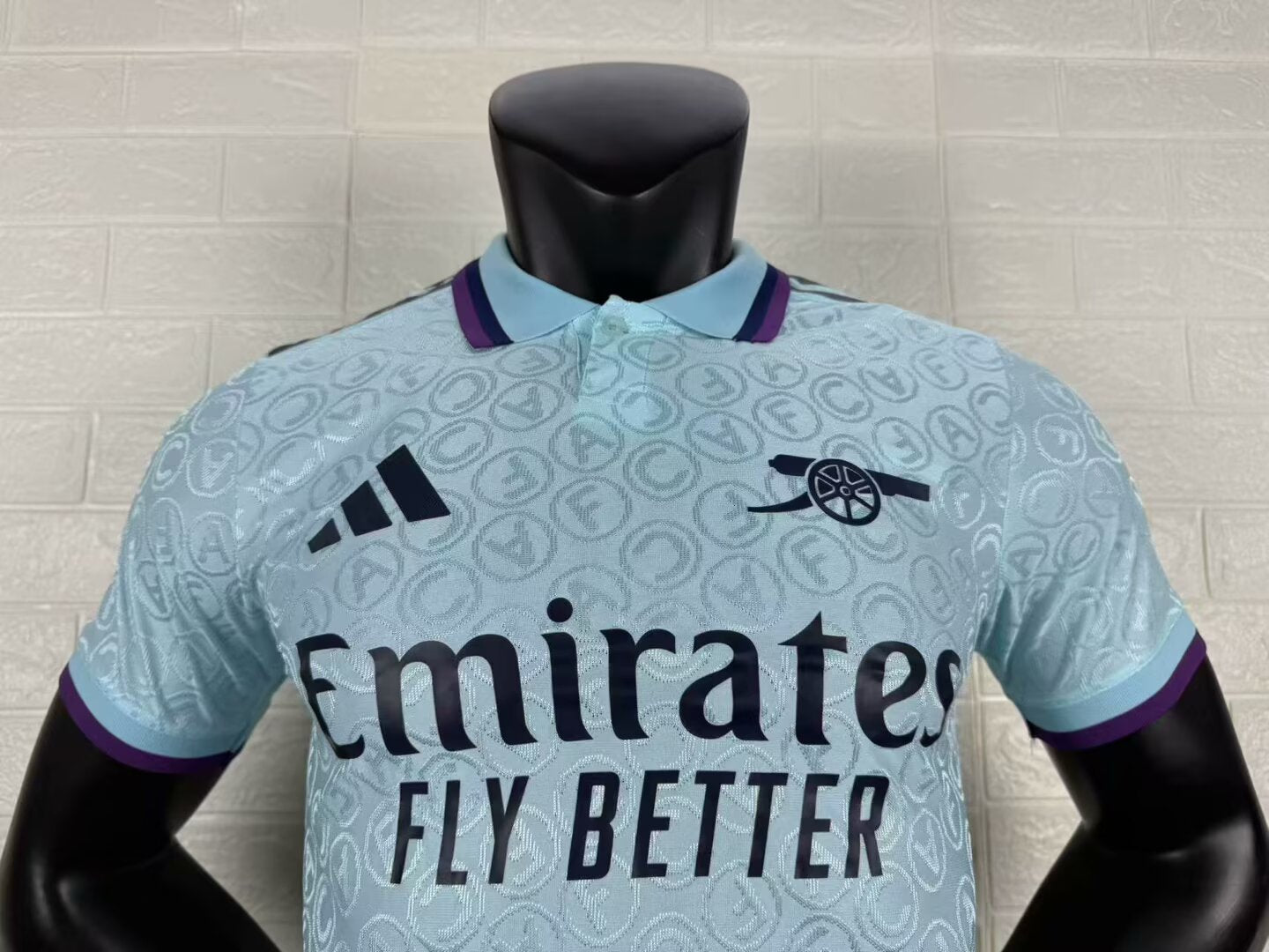 2025/26 Arsenal Special Edition Player Version Jersey - Ice Blue Body All-Over Tonal Cannon Circular Emboss Pattern Deep Purple Polo Collar Deep Purple Sleeve Cuff Trim - Dark Navy Three Stripes - Dark Navy Arsenal Cannon Crest - Emirates Fly Better