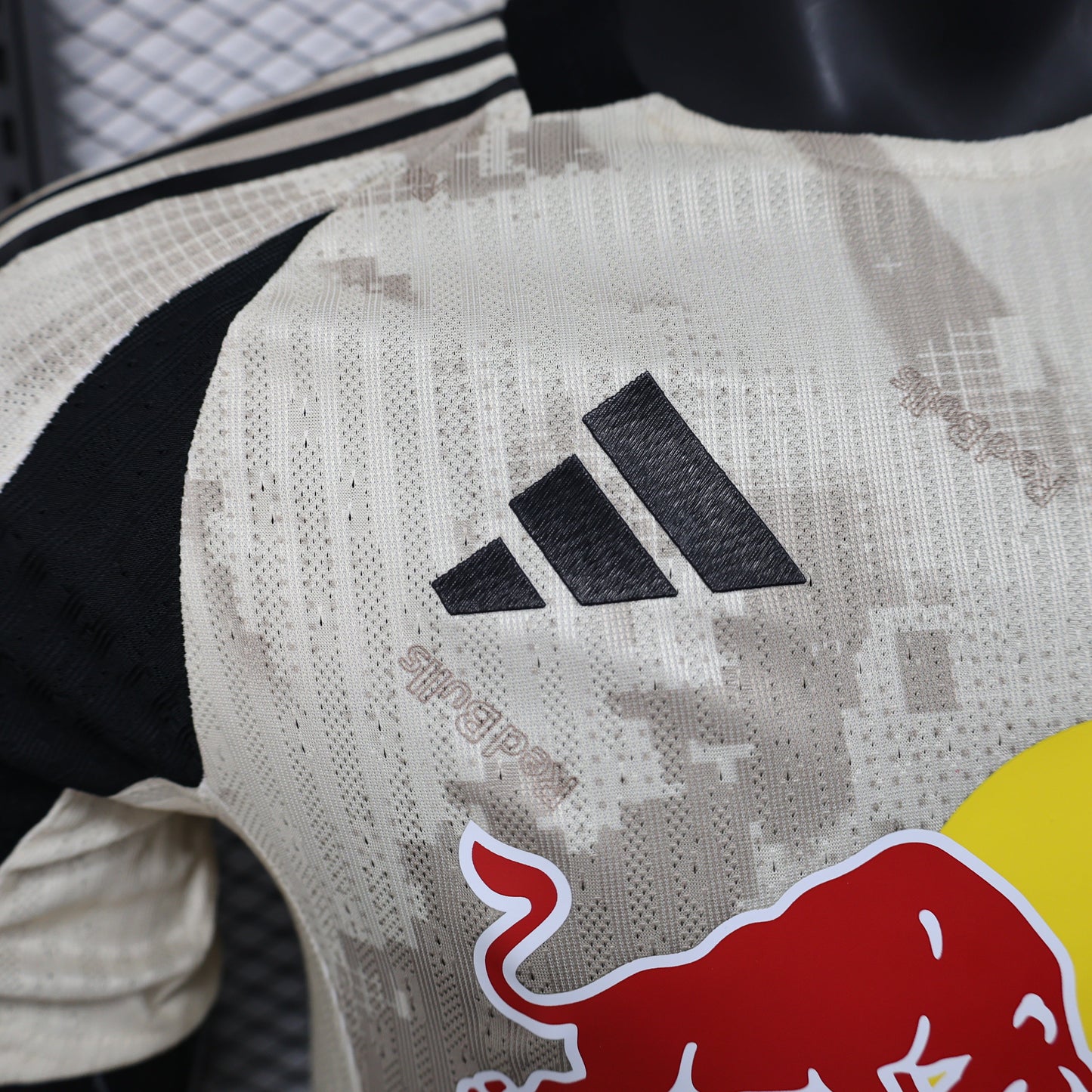 2025/26 New York Red Bulls Away Player Version Jersey - Adidas - Off-White Cream Desert Camouflage Pattern - Black Side Panels - Red Bull Double Bull Yellow Sun Crest