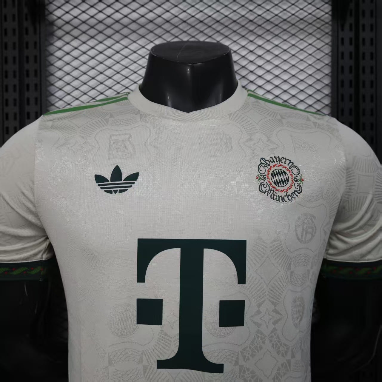 2025/26 Bayern Munich Beer Edition Player Version Jersey - Off-White Body - Dark Green Crew Neck Trim & Sleeve Cuffs - Bayern Munich Dark Green Special Crest - Deutsche Telekom T Dark Green Principal Sponsor