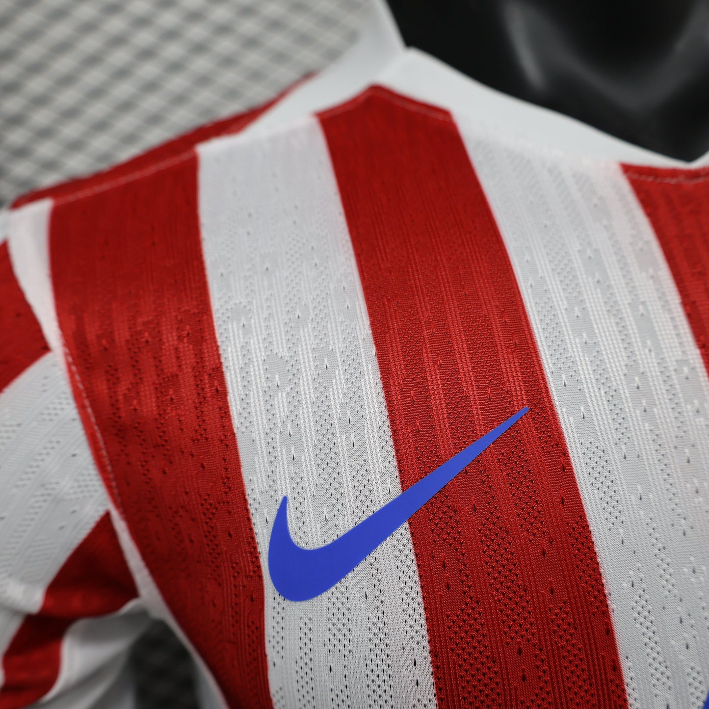 2025/26 Atlético de Madrid Home Player Version Jersey -  Red & White Vertical Wide Stripe - White V-Neck Collar - Blue Nike Swoosh - Atlético Crest - Riyadh Air Blue Sponsor