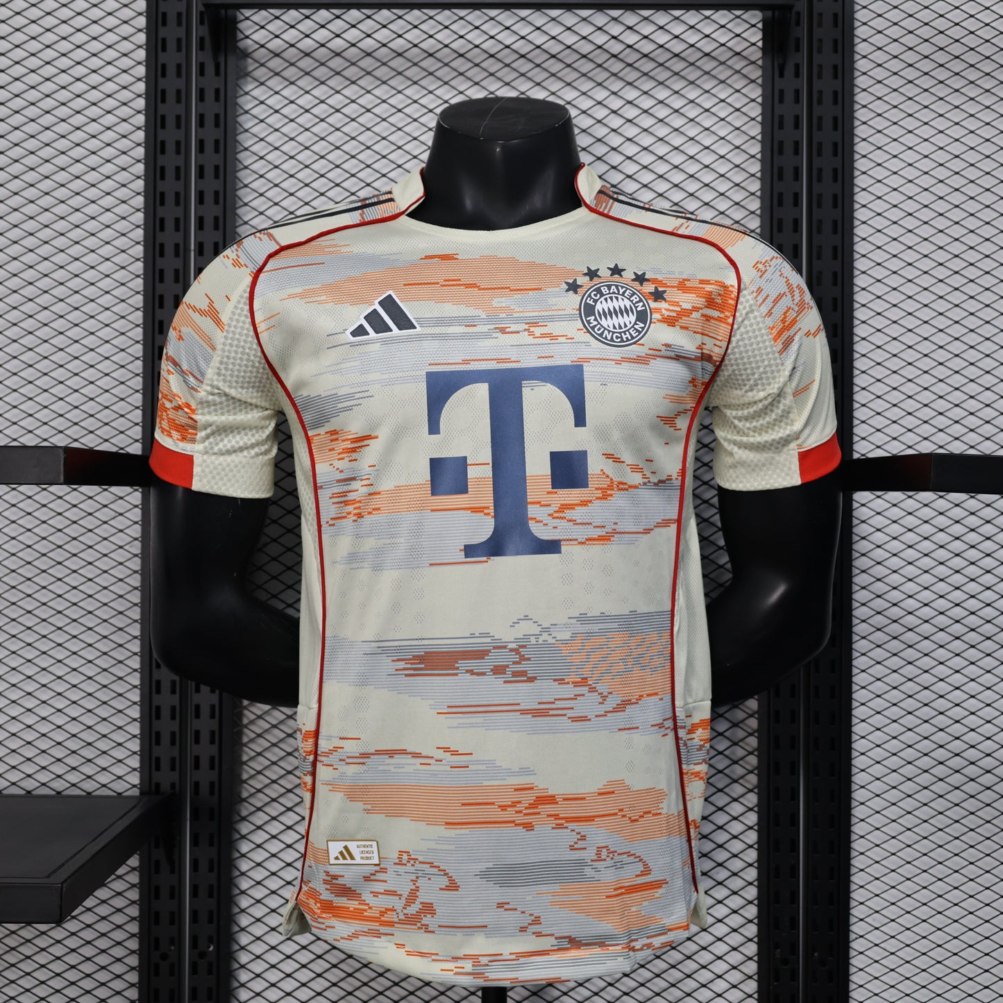 2025/26 Bayern Munich Away Player Version Jersey -  Body Orange Grey Horizontal Brush Stroke Graphic  - Red Side Seam Piping Red Sleeve Cuffs Black Shoulder Stripes - FC Bayern Crest - Deutsche Telekom T Logo