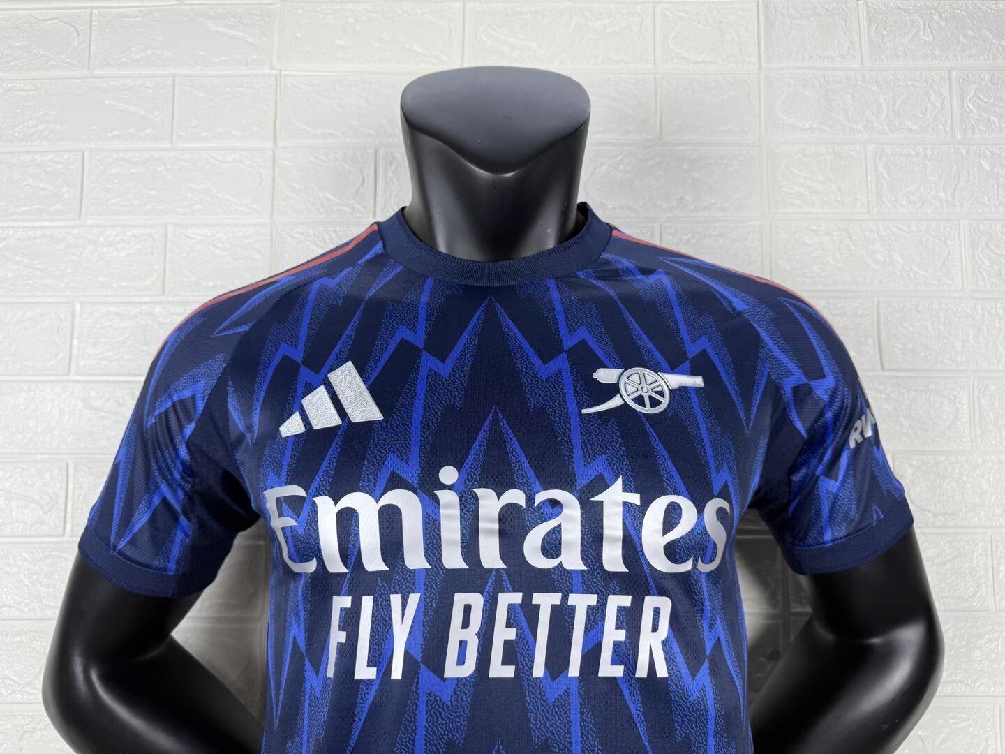 2025/26 Arsenal Away Player Version Jersey - Dark Navy Blue Body All-Over Blue Lightning Bolt Zigzag Graphic - White Three Stripes - Arsenal Cannon Crest - Emirates Fly Better Principal Sponsor