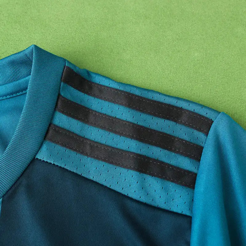 Real Madrid CF Third Retro Fan Version Jersey 2017/18 – Teal Football Shirt with Navy Pixel Block Design