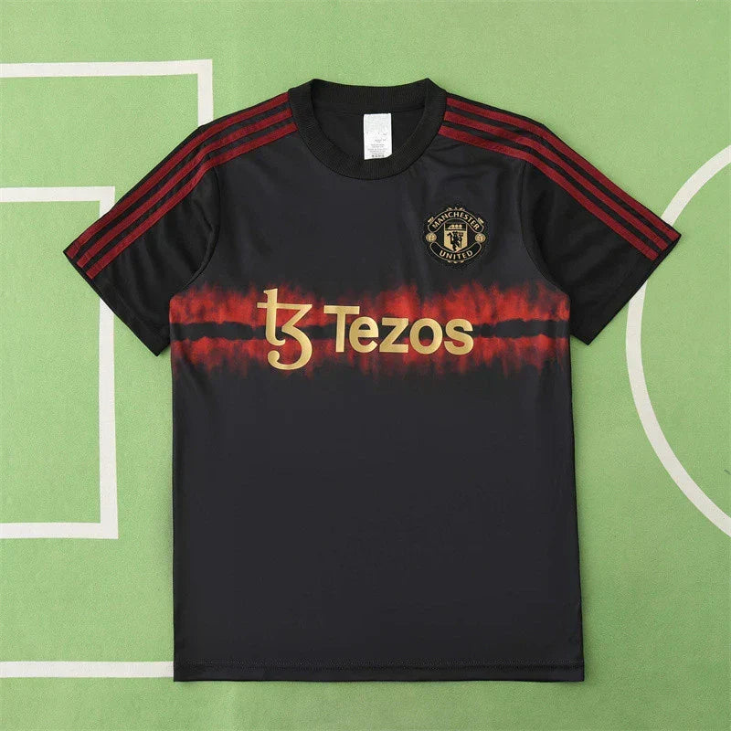 Manchester United Year of the Snake Limited Edition Training Shirt Fan Version 2024/25 – Black Gold Tezos Pre-Match Top